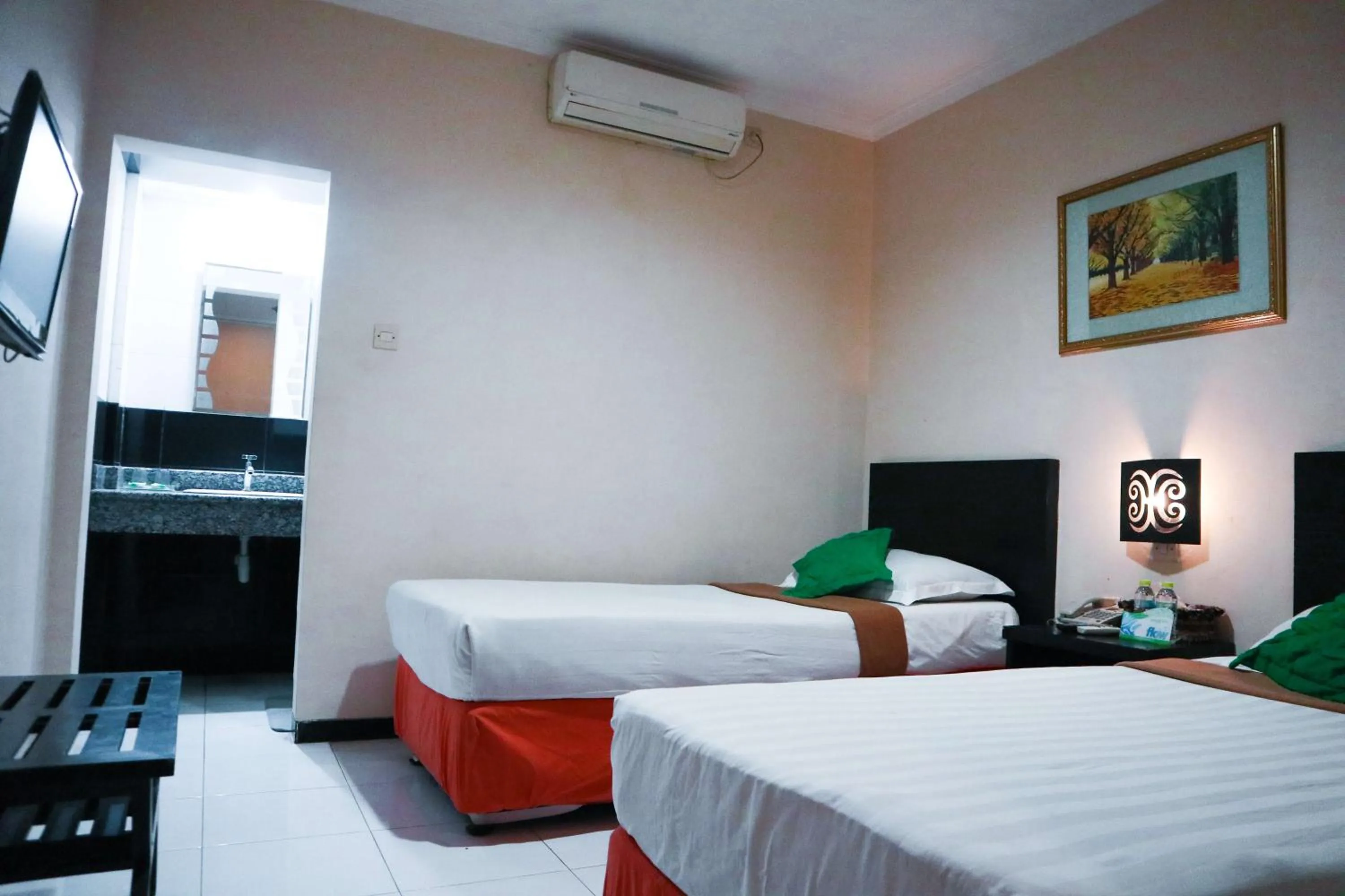 Bed in Helios Hotel Malang