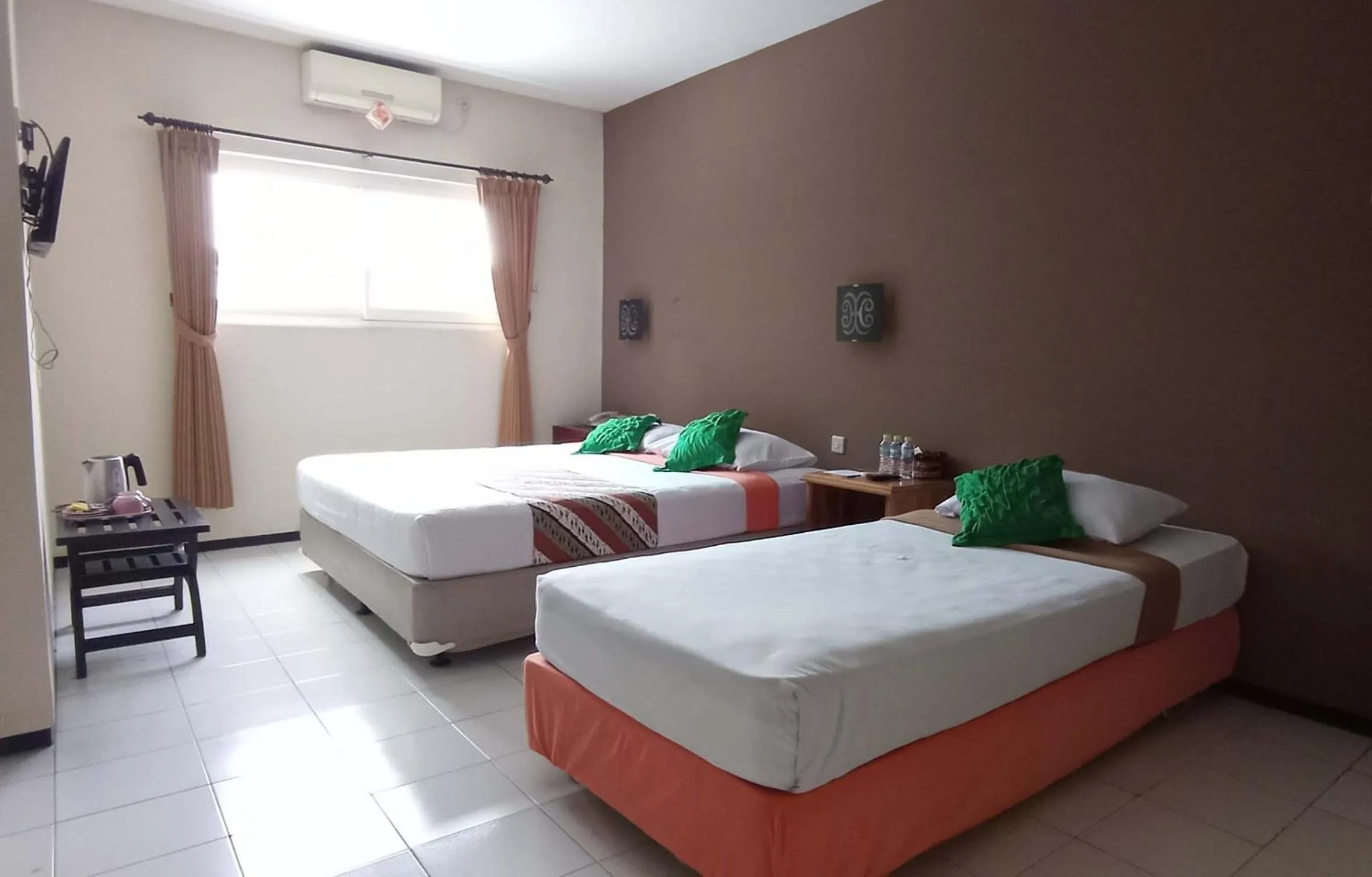 Bed in Helios Hotel Malang