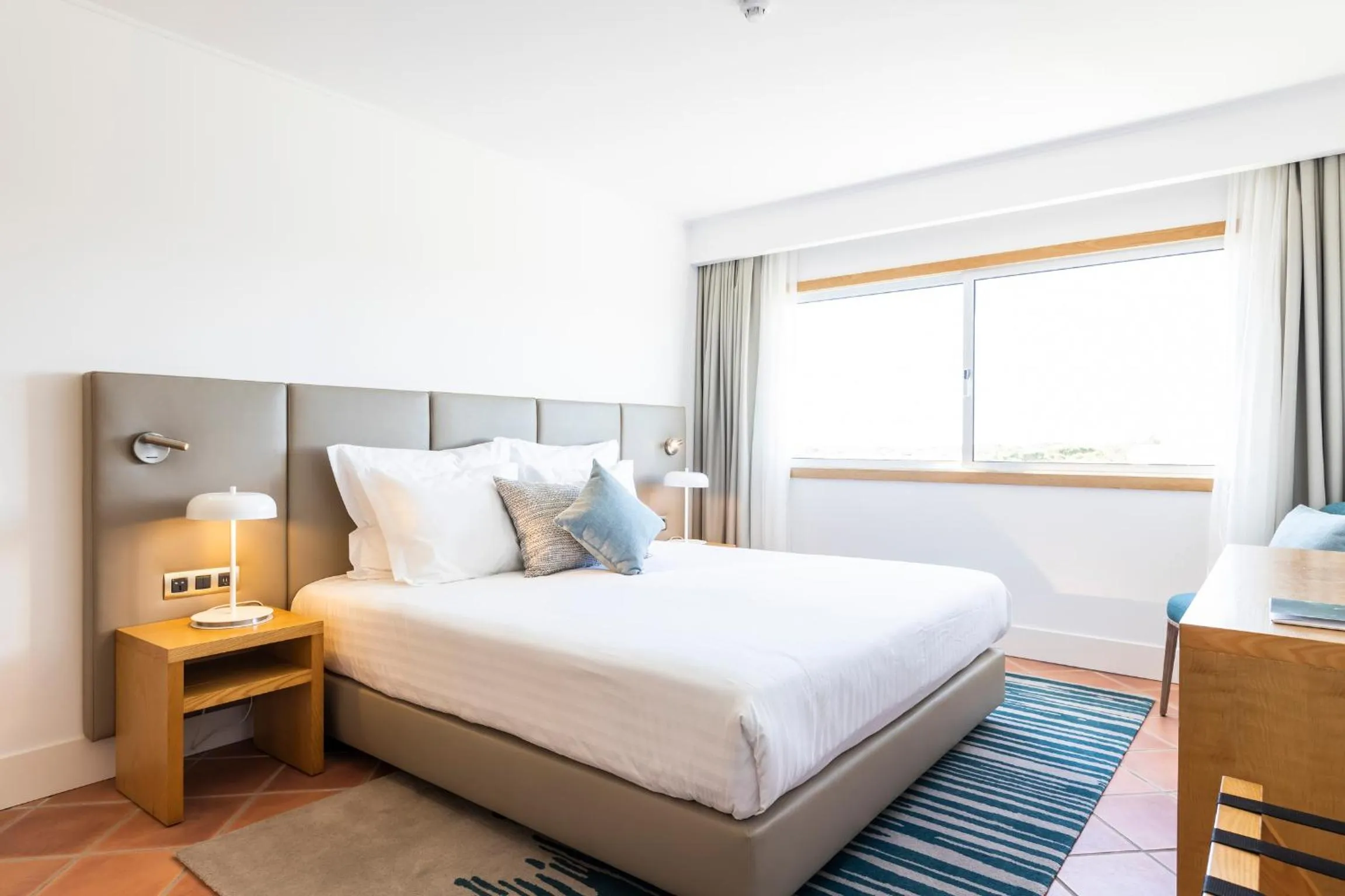 Bed in The Patio Suite Hotel