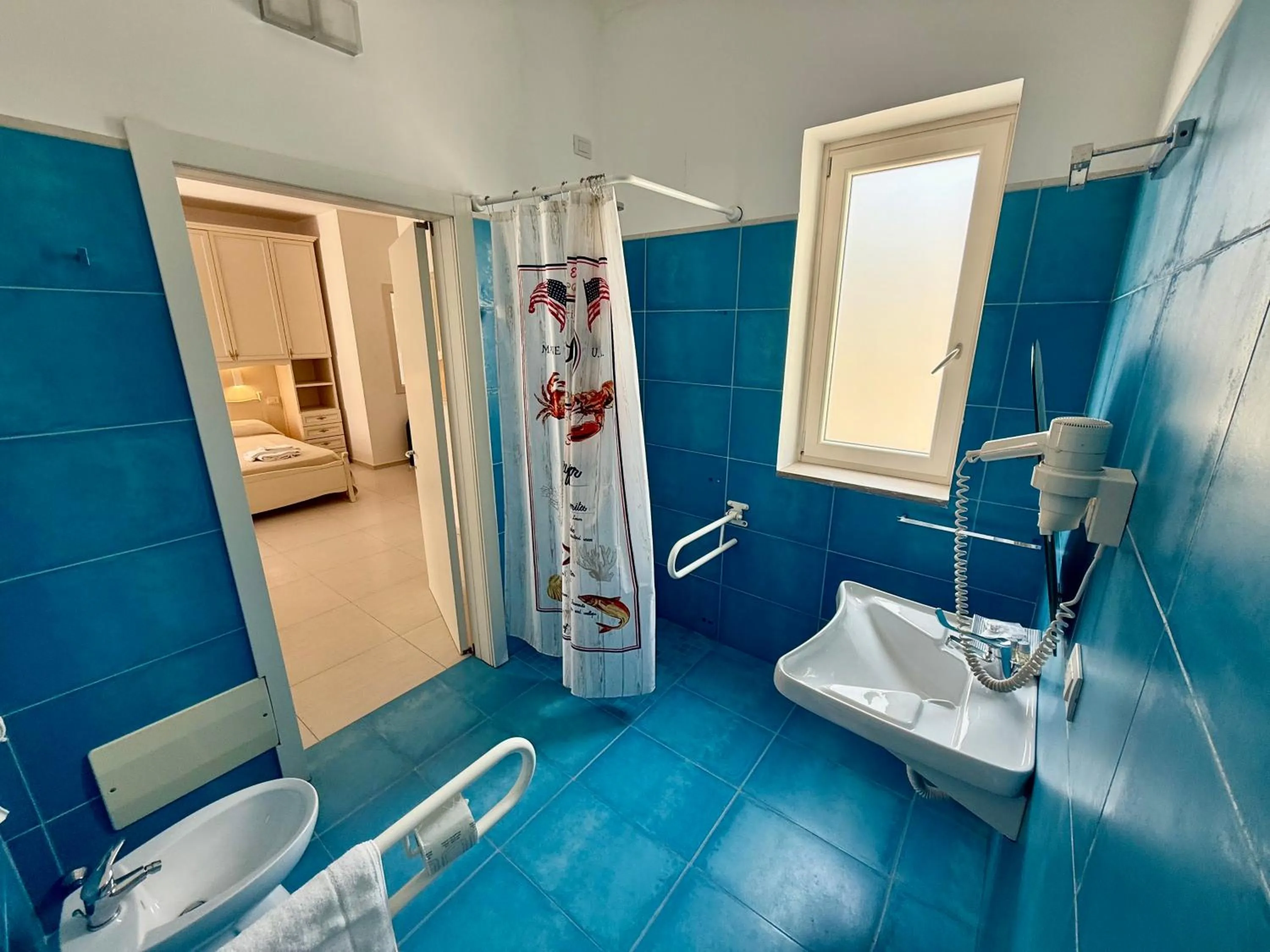 Bathroom in Baia Sangiorgio Hotel & Beach Club