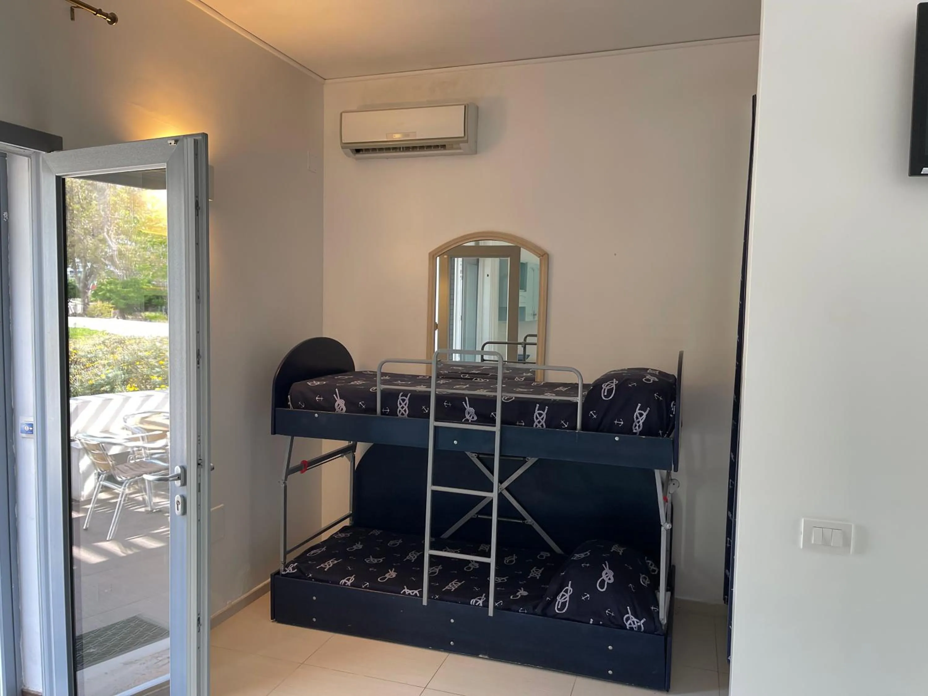 bunk bed in Baia Sangiorgio Hotel & Beach Club