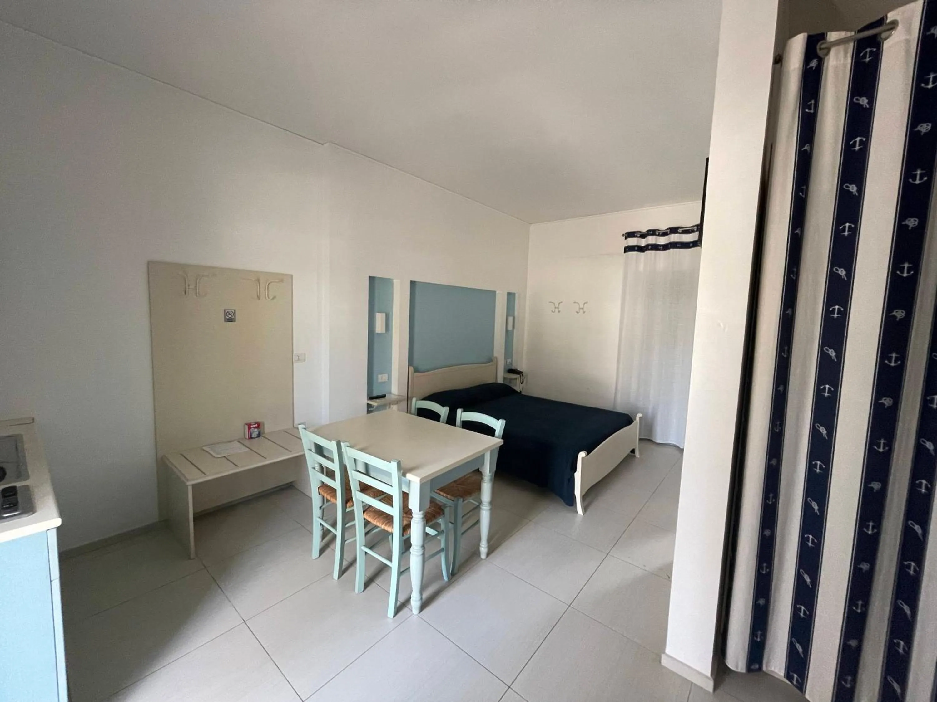 Bed in Baia Sangiorgio Hotel & Beach Club