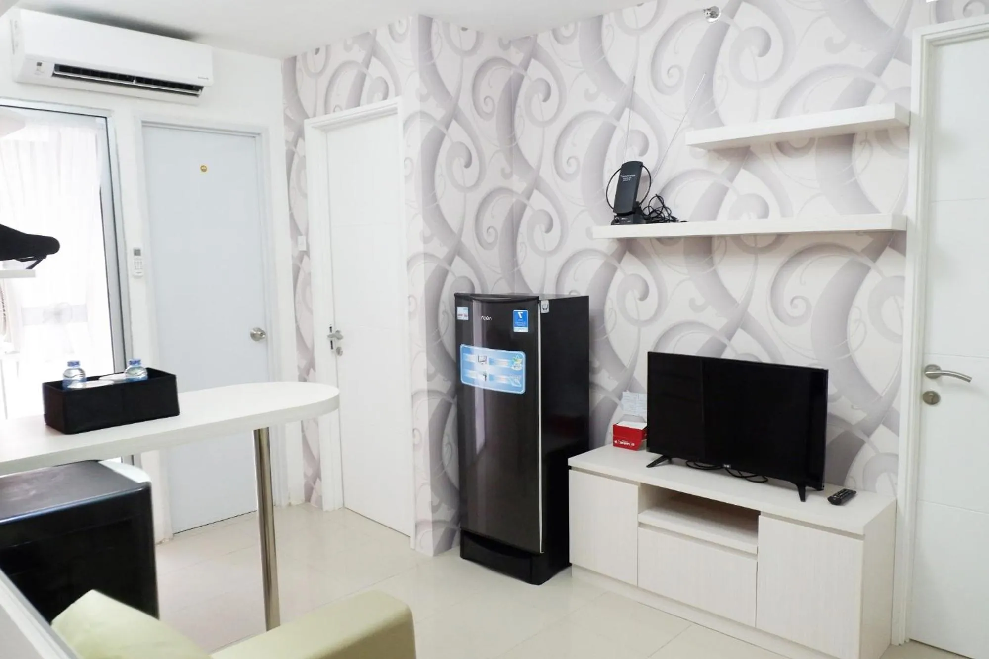 TV and multimedia in Exquisite 2BR Bassura City Apartment near Shopping Mall By Travelio
