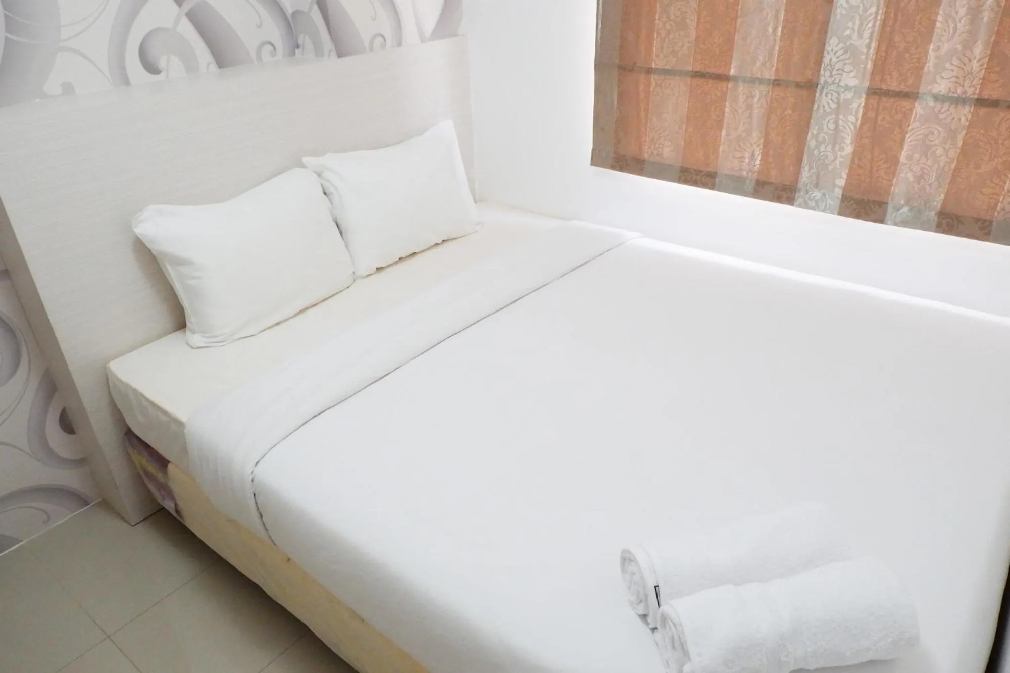 Bed in Exquisite 2BR Bassura City Apartment near Shopping Mall By Travelio