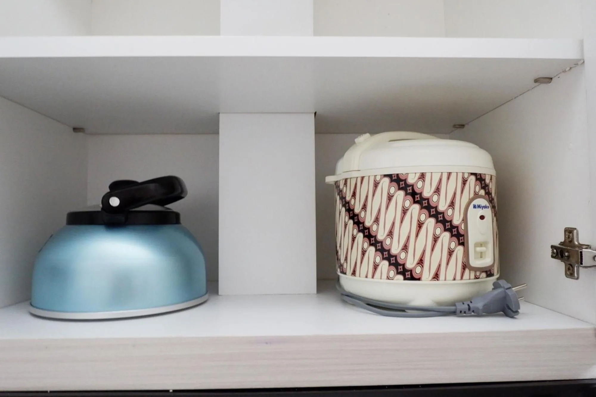 Kitchen or kitchenette in Exquisite 2BR Bassura City Apartment near Shopping Mall By Travelio