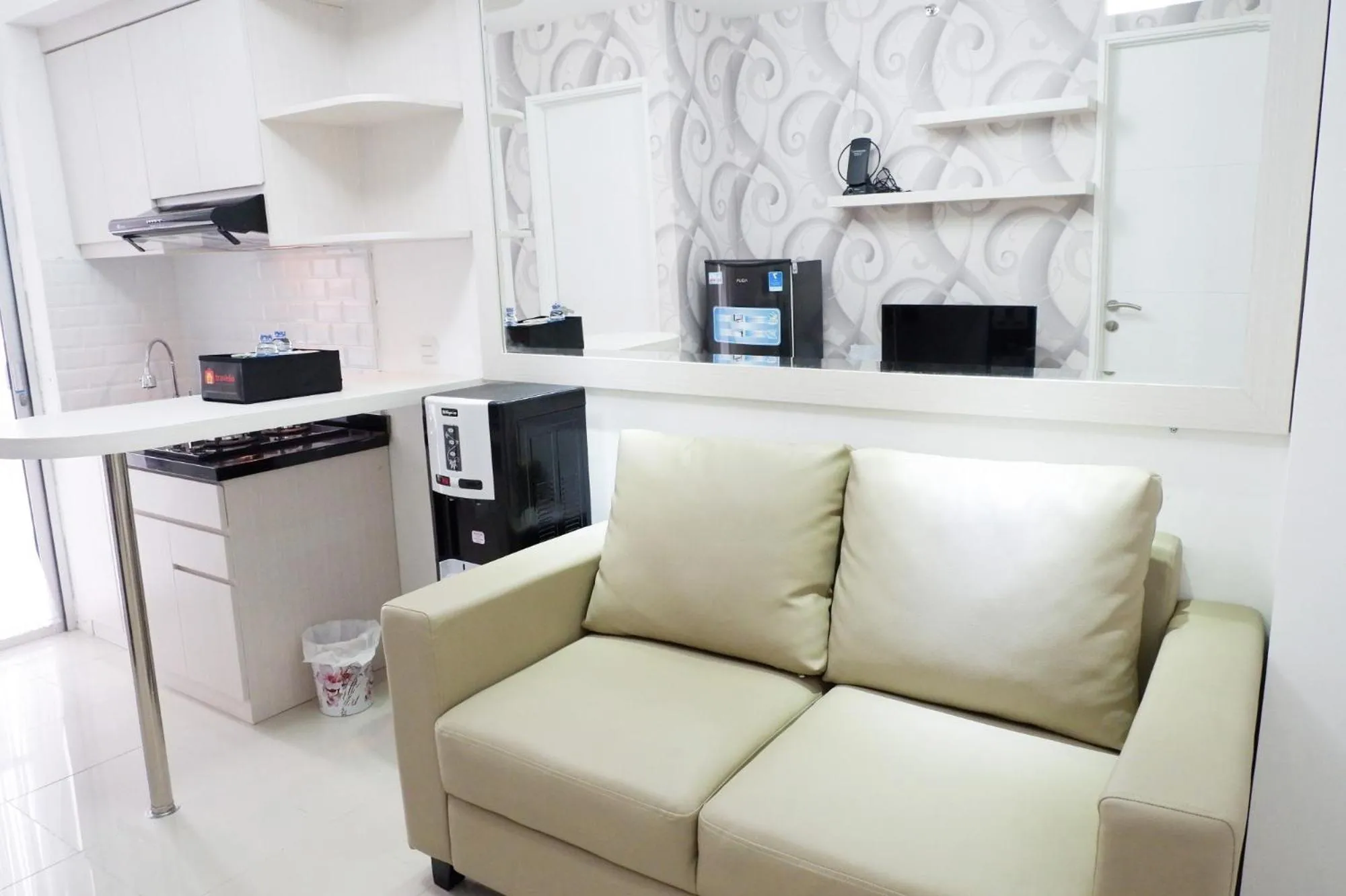 Living room in Exquisite 2BR Bassura City Apartment near Shopping Mall By Travelio