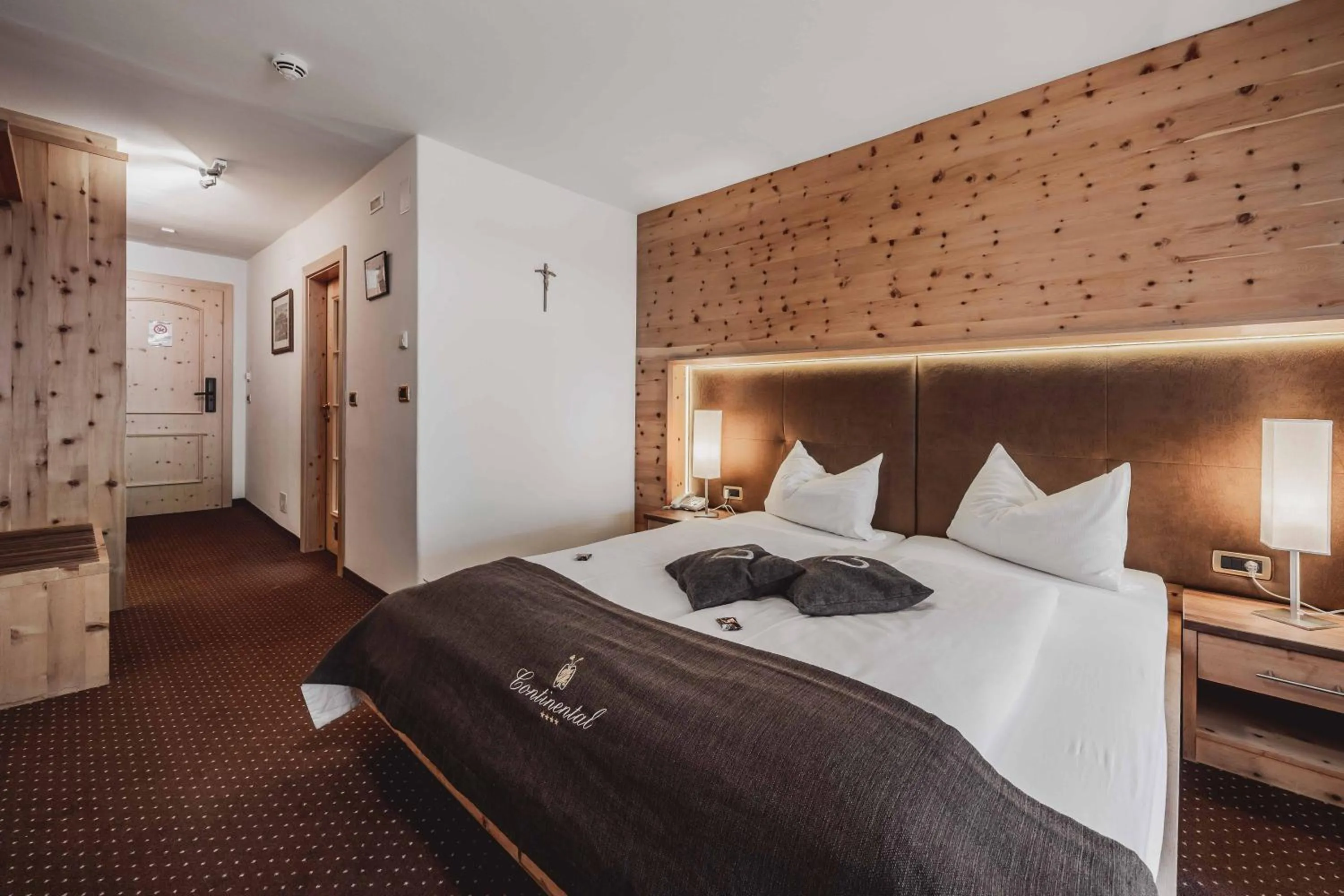 Bed in Hotel Continental Dolomites