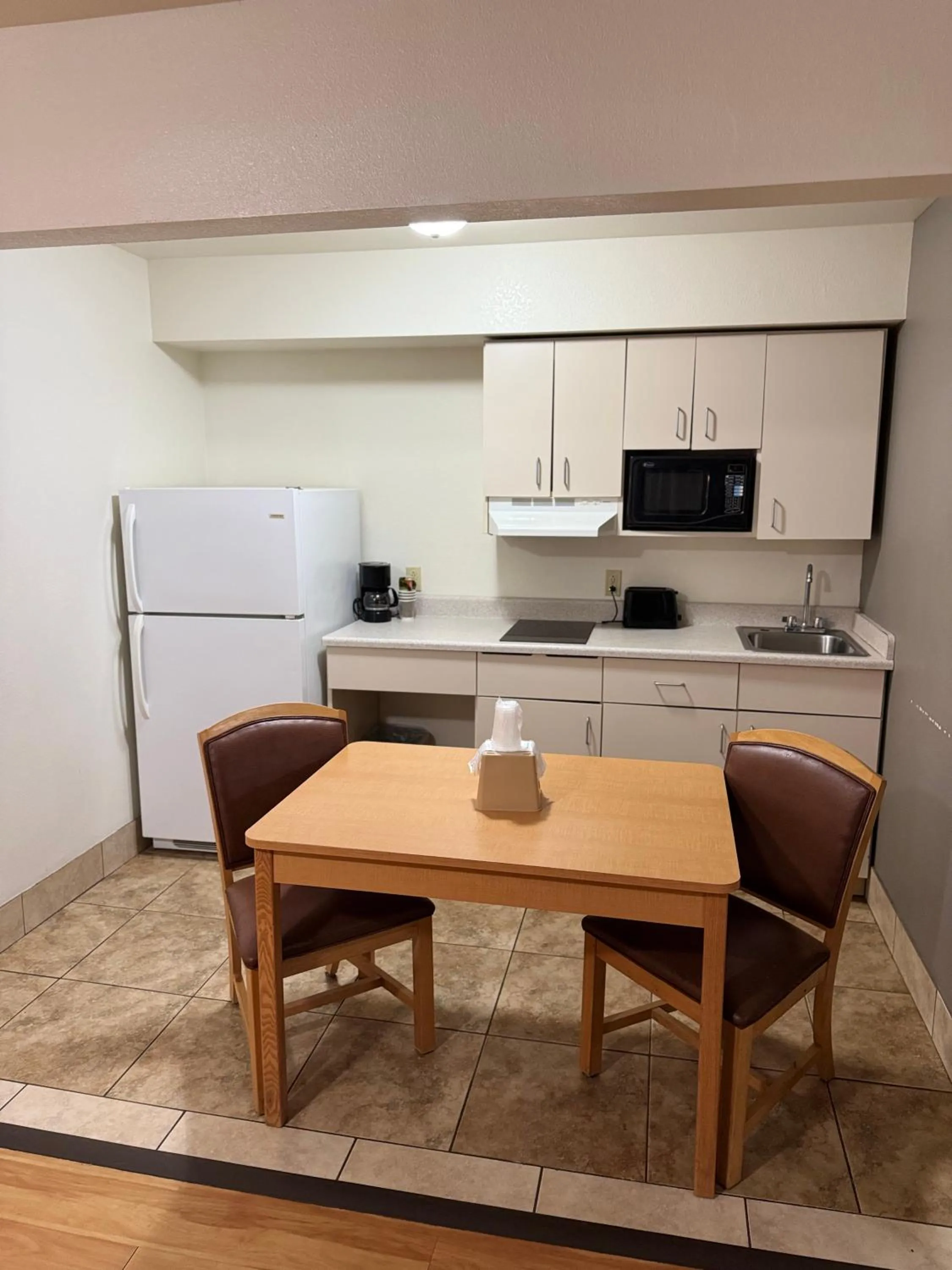 Kitchen or kitchenette in Blue Bonnet Suites -Lubbock, TX - Medical Center