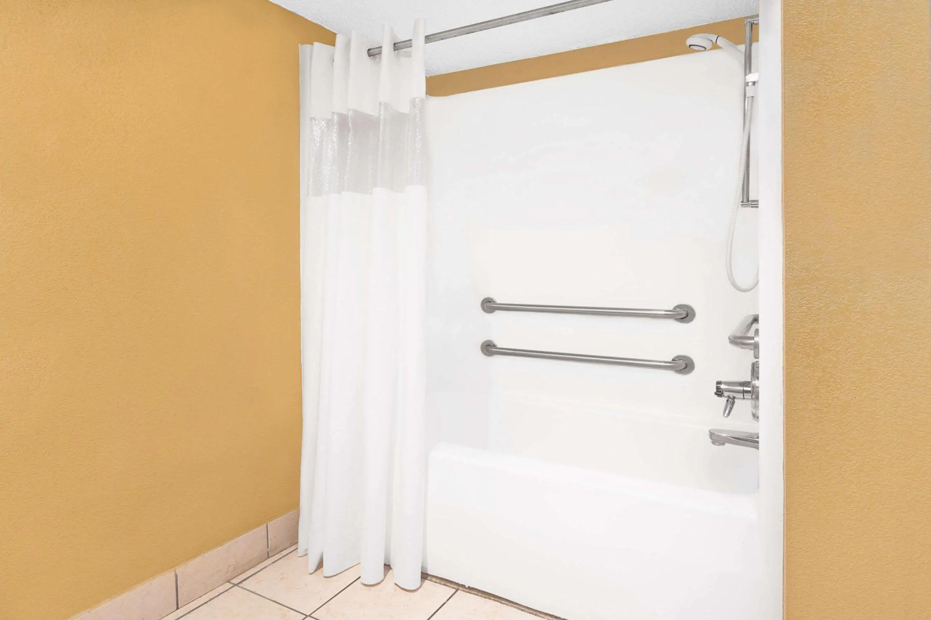 Bathroom in Days Inn by Wyndham N Little Rock East