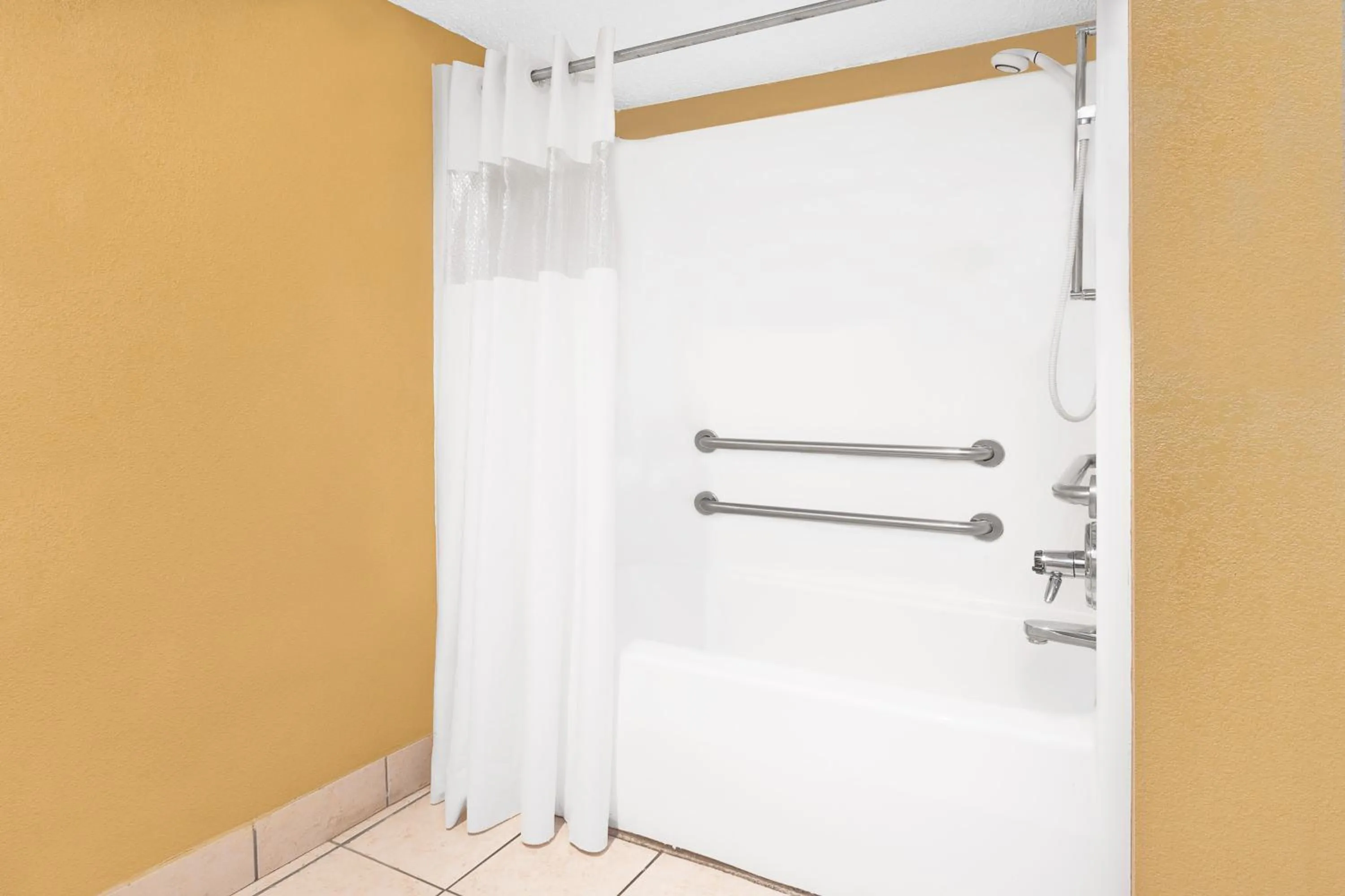 Bathroom in Days Inn by Wyndham N Little Rock East