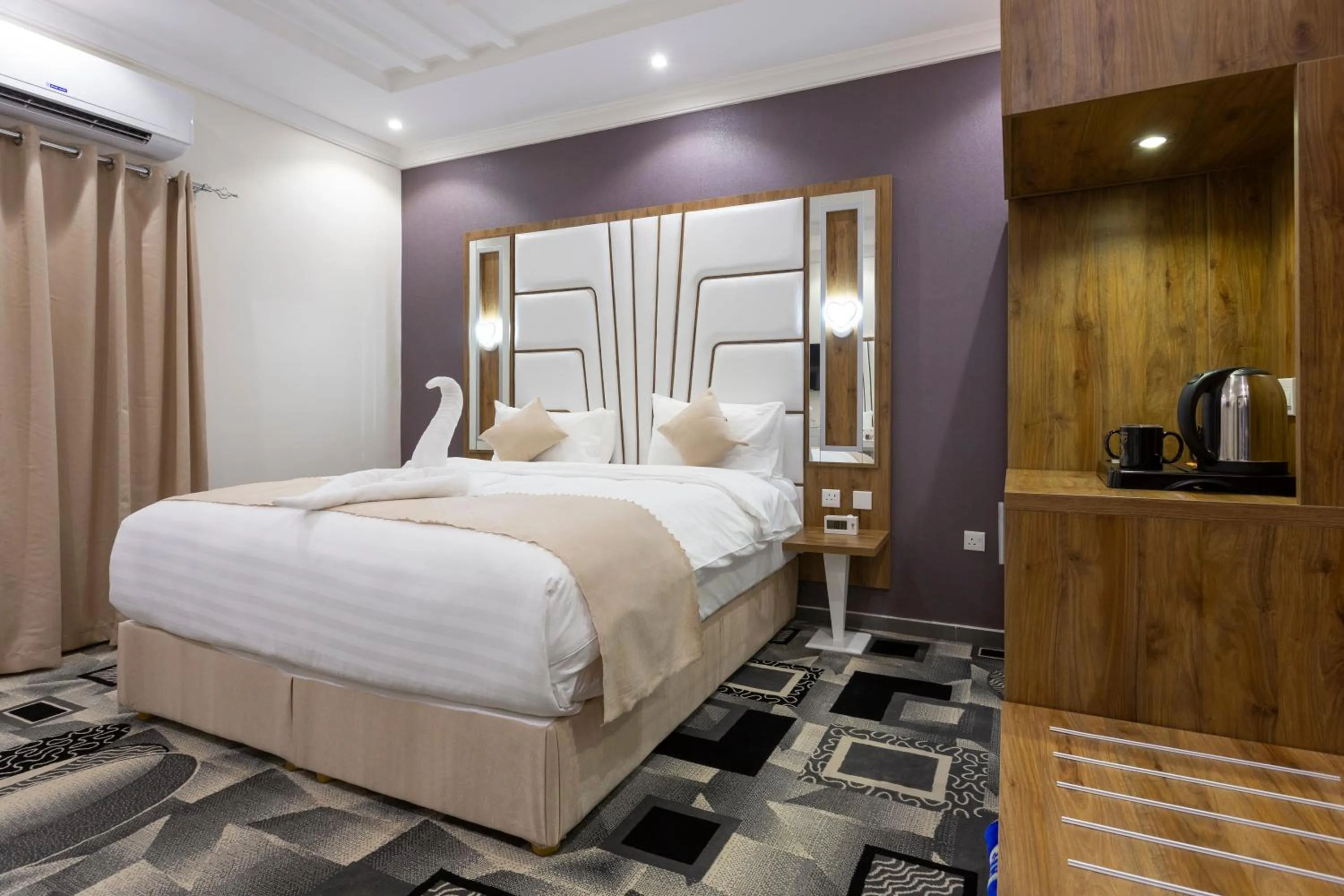 Bed in Dior Inn serviced apartments