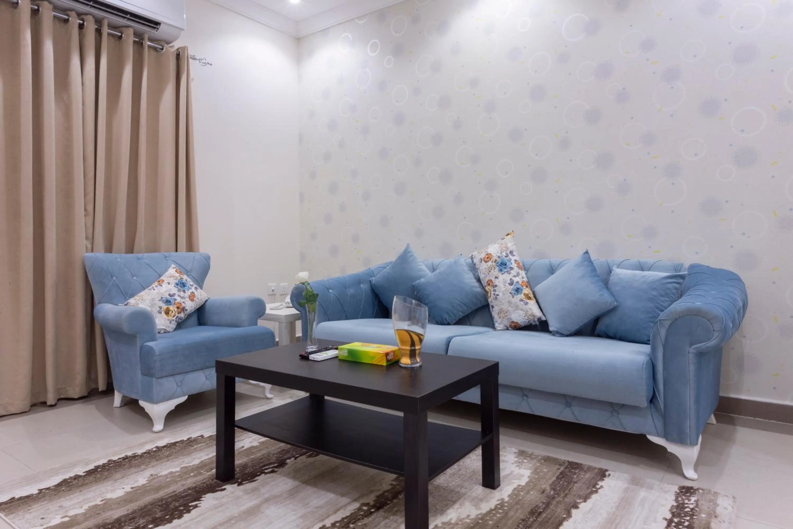 Seating area in Dior Inn serviced apartments