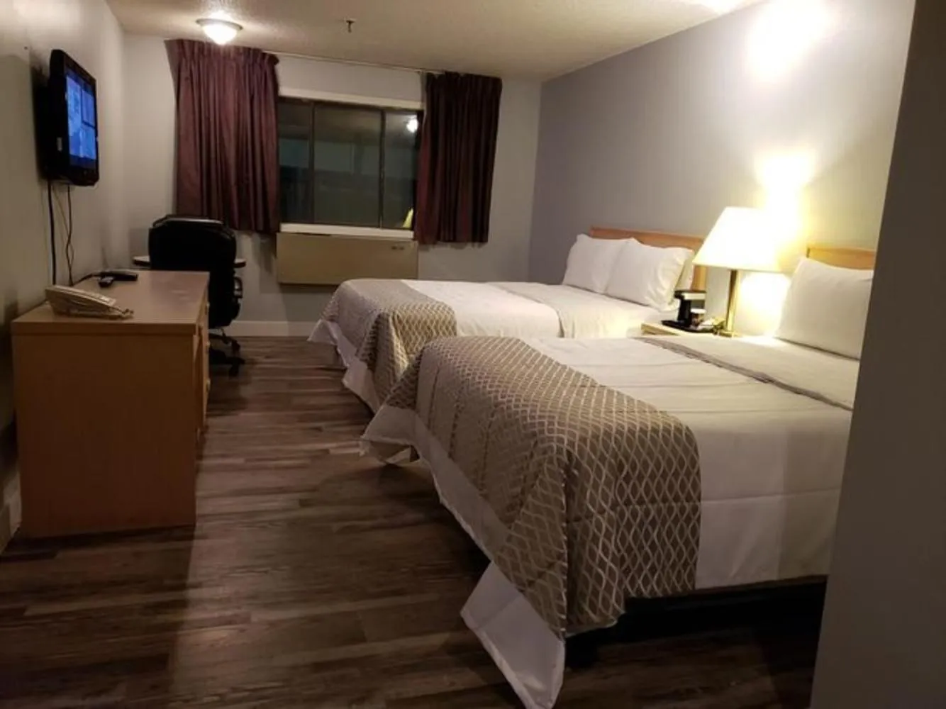 Bed in Venture Inn Hotel