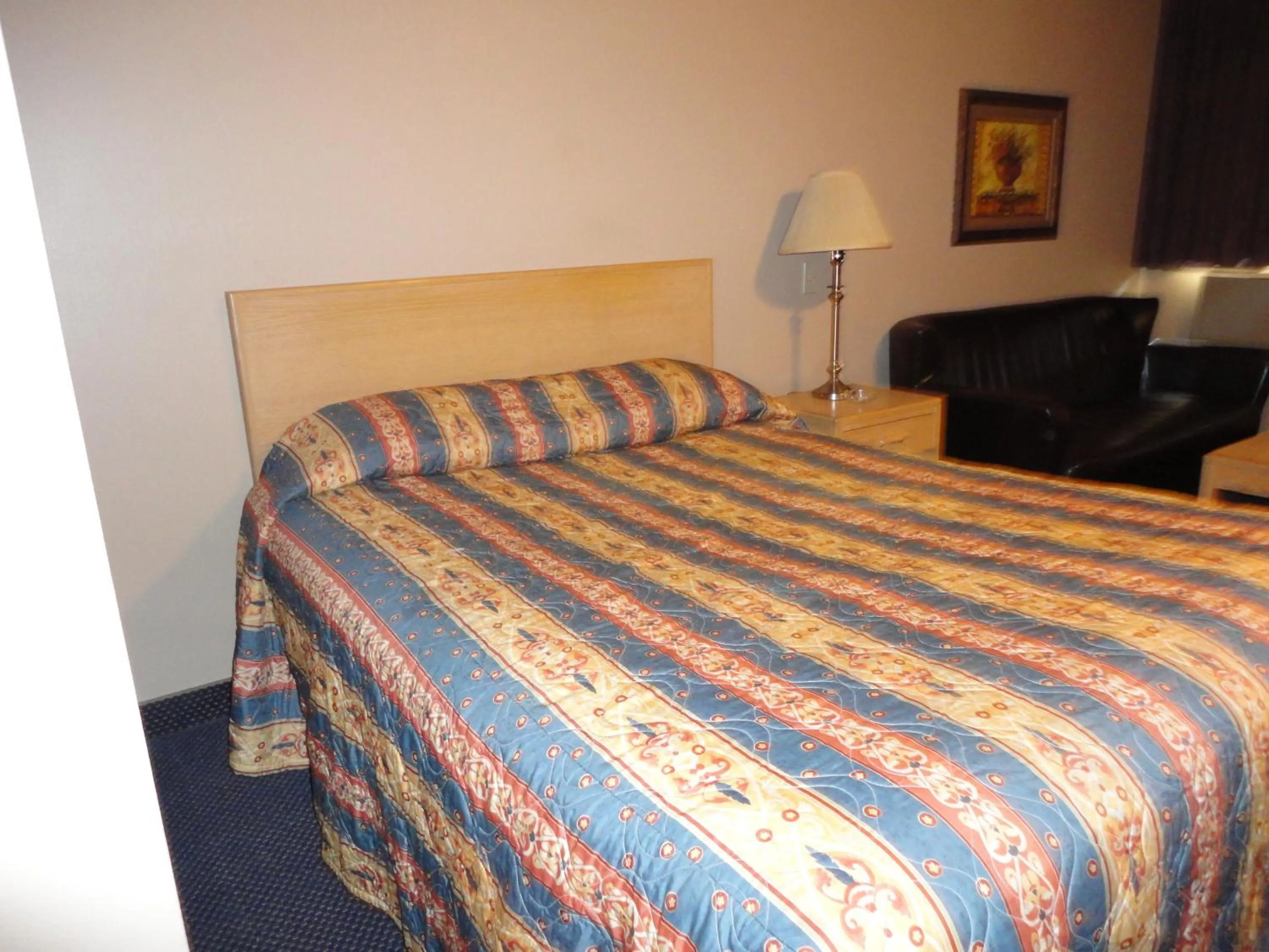 Bed in Venture Inn Hotel