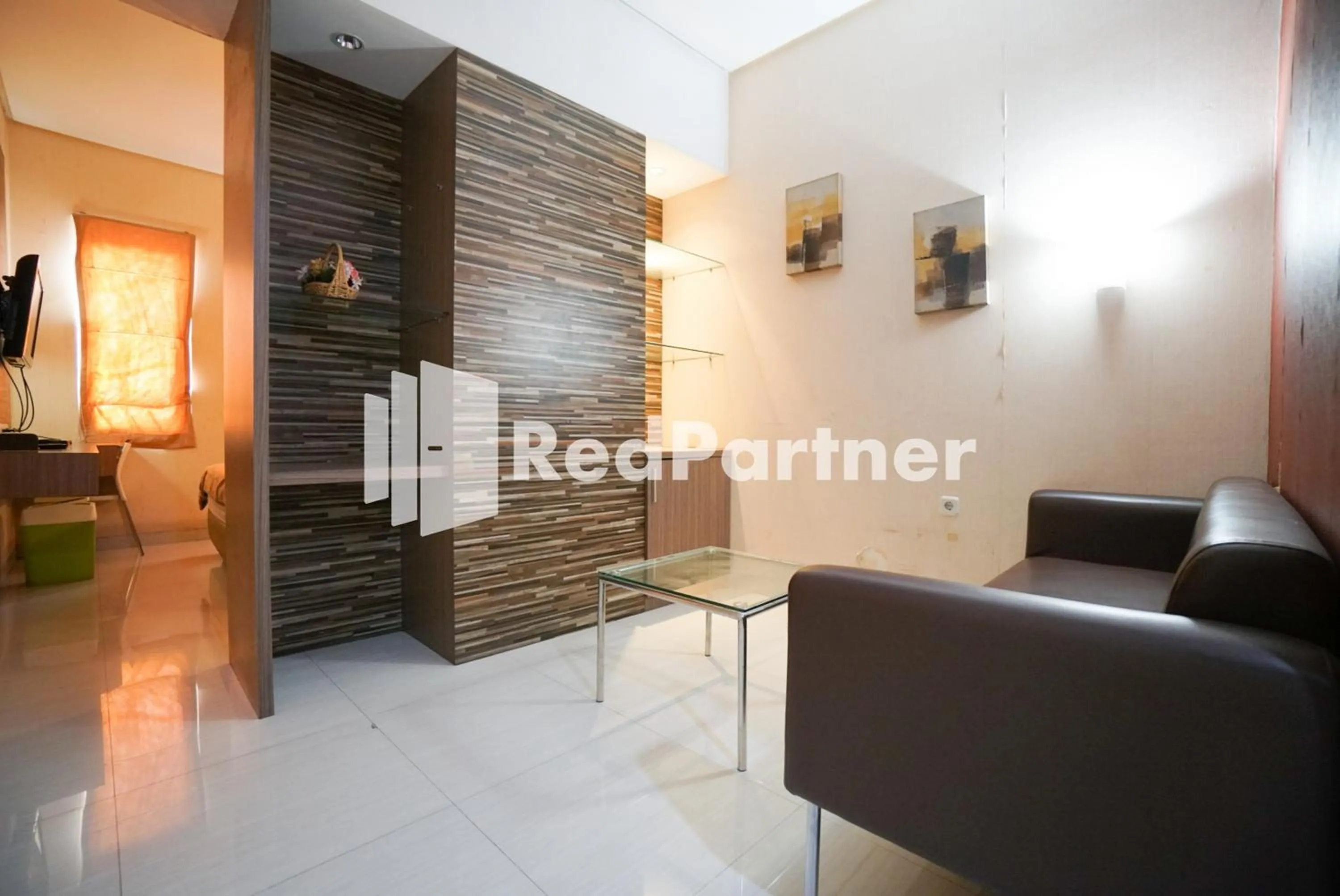 Seating area in Tirta Mansion Lippo Karawaci Mitra RedDoorz