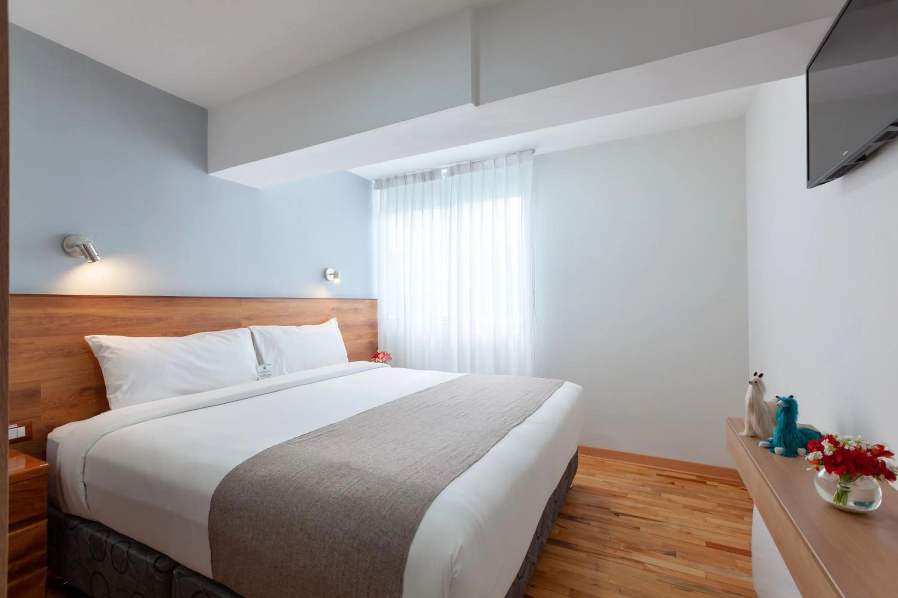 Decorative detail, Bed in Muru Homely Hotel Cusco