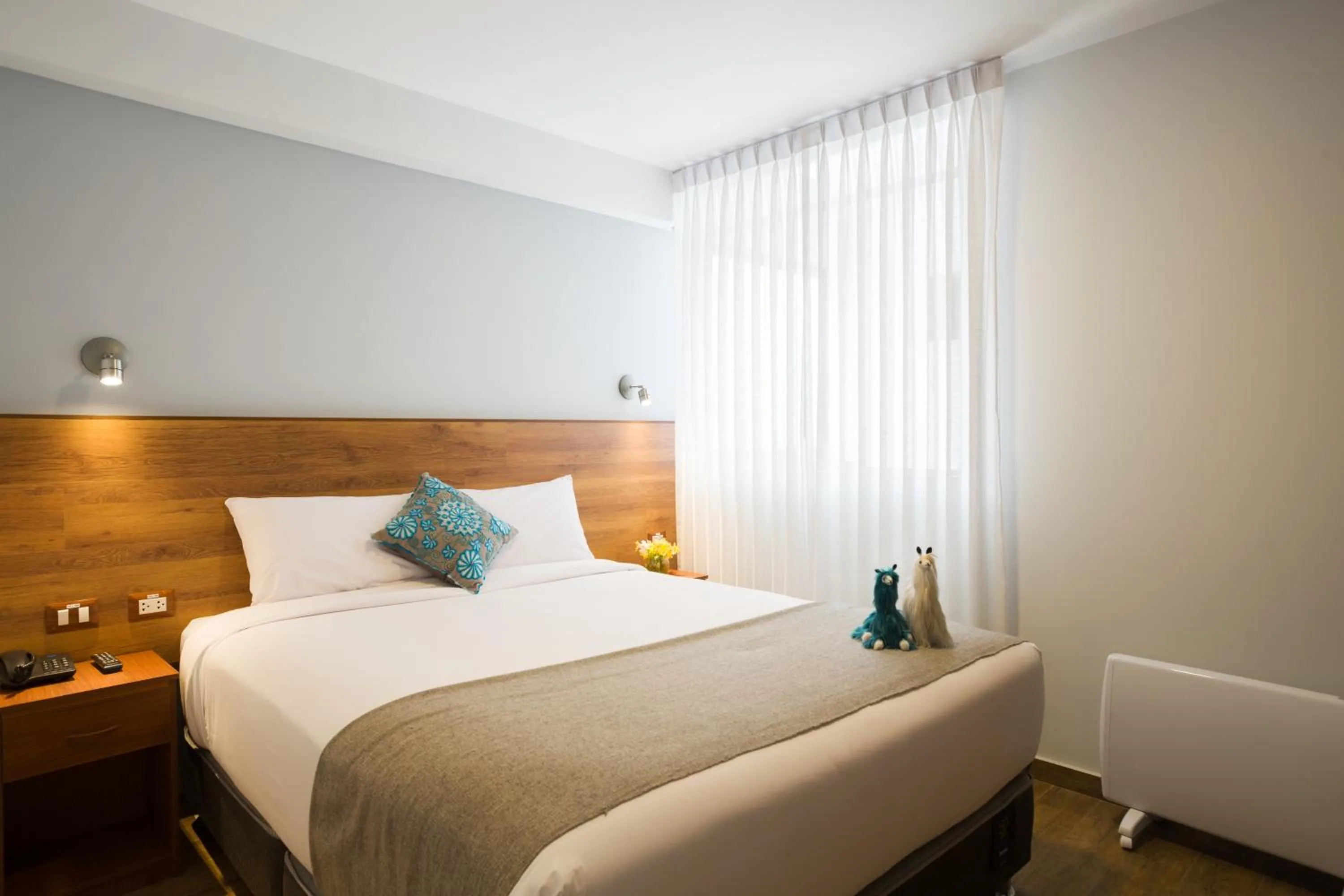 Bed in Muru Homely Hotel Cusco