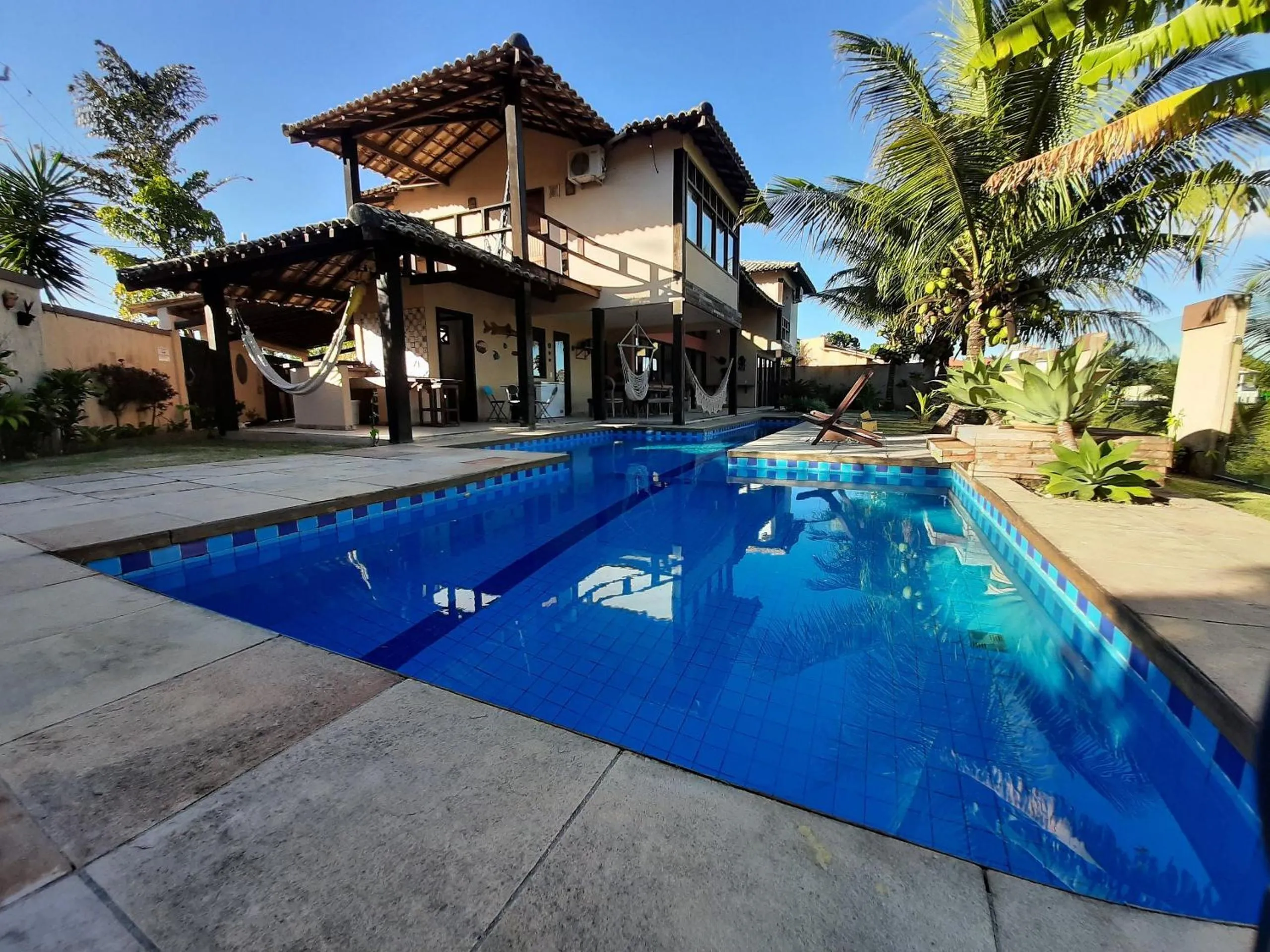 Swimming pool in Casa confortável Vista Mar e Piscina em Taperapuan