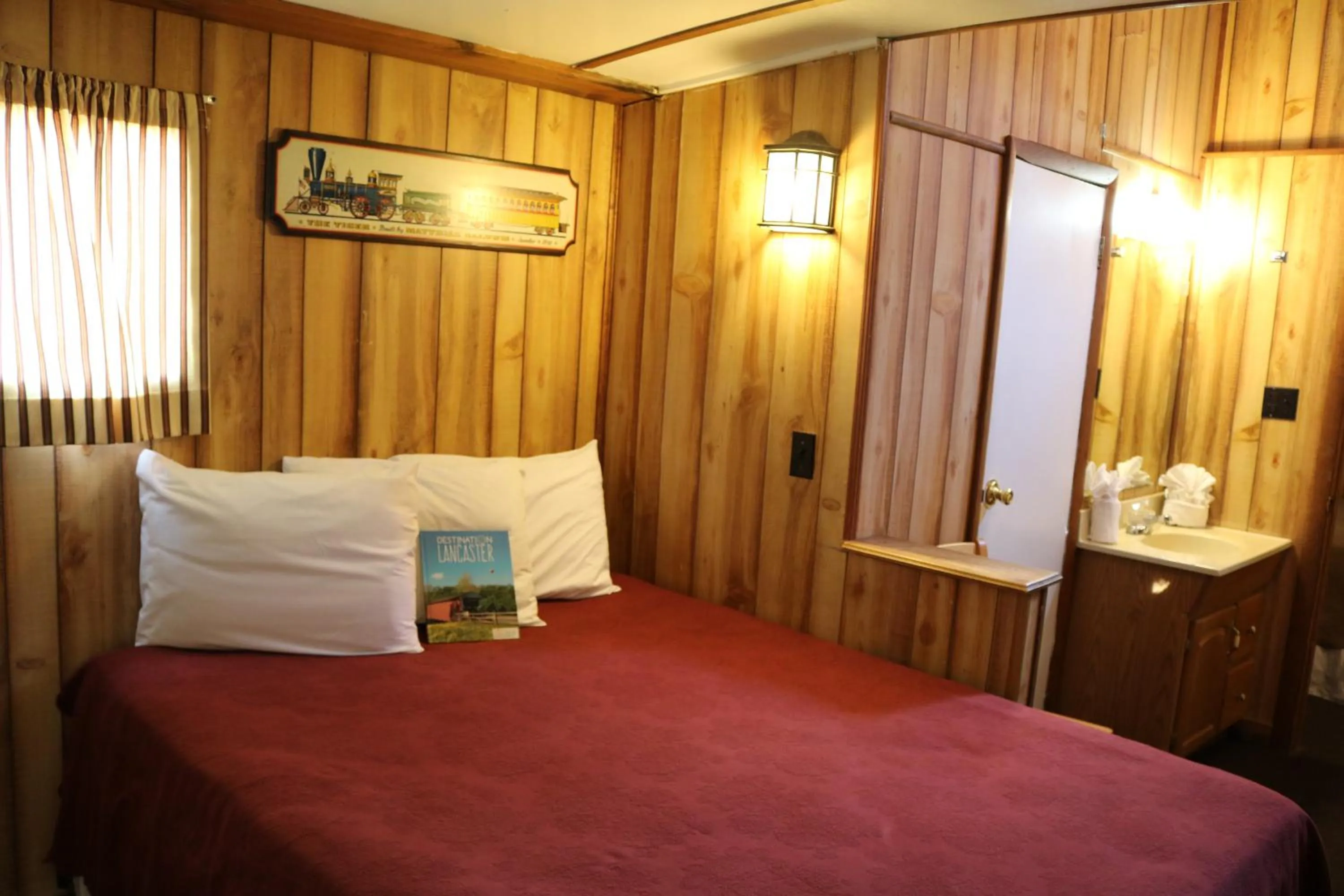 Bed in Red Caboose Motel & Restaurant