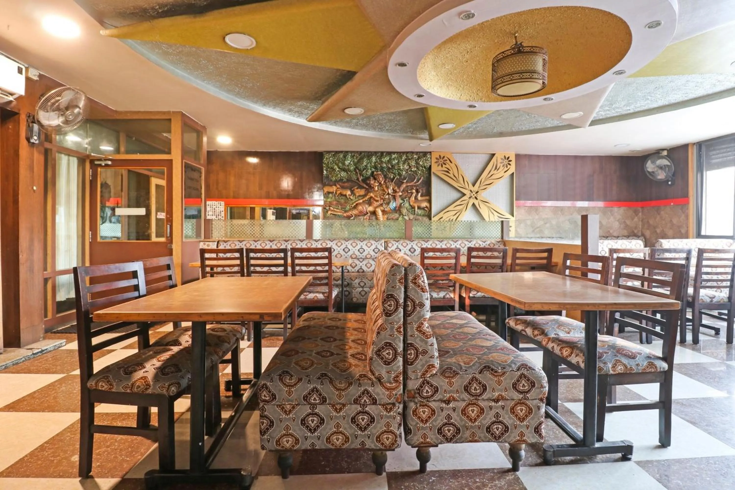 Dining area in Collection O Madhura Residency