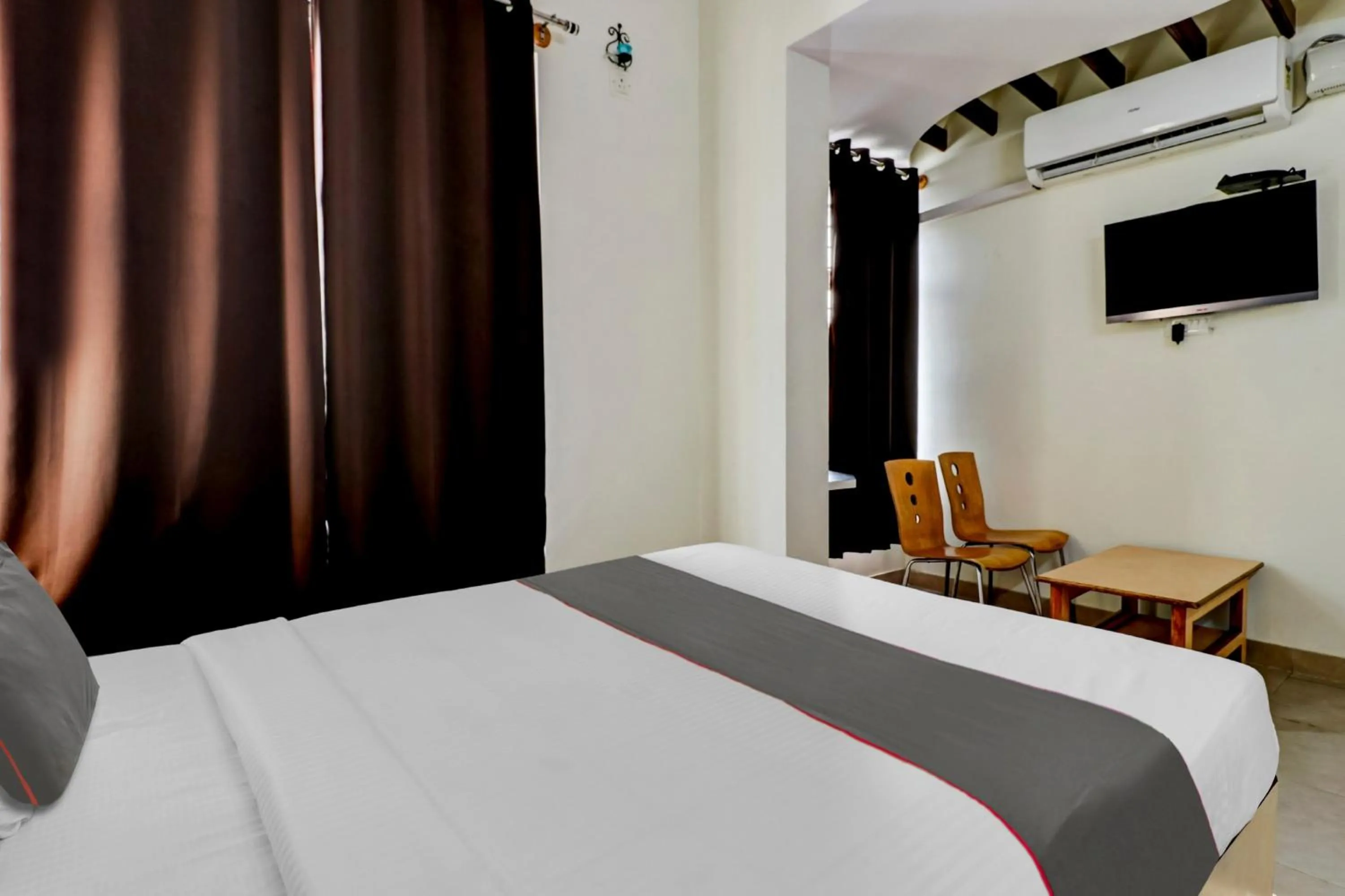 Bathroom, Bed in Collection O Madhura Residency