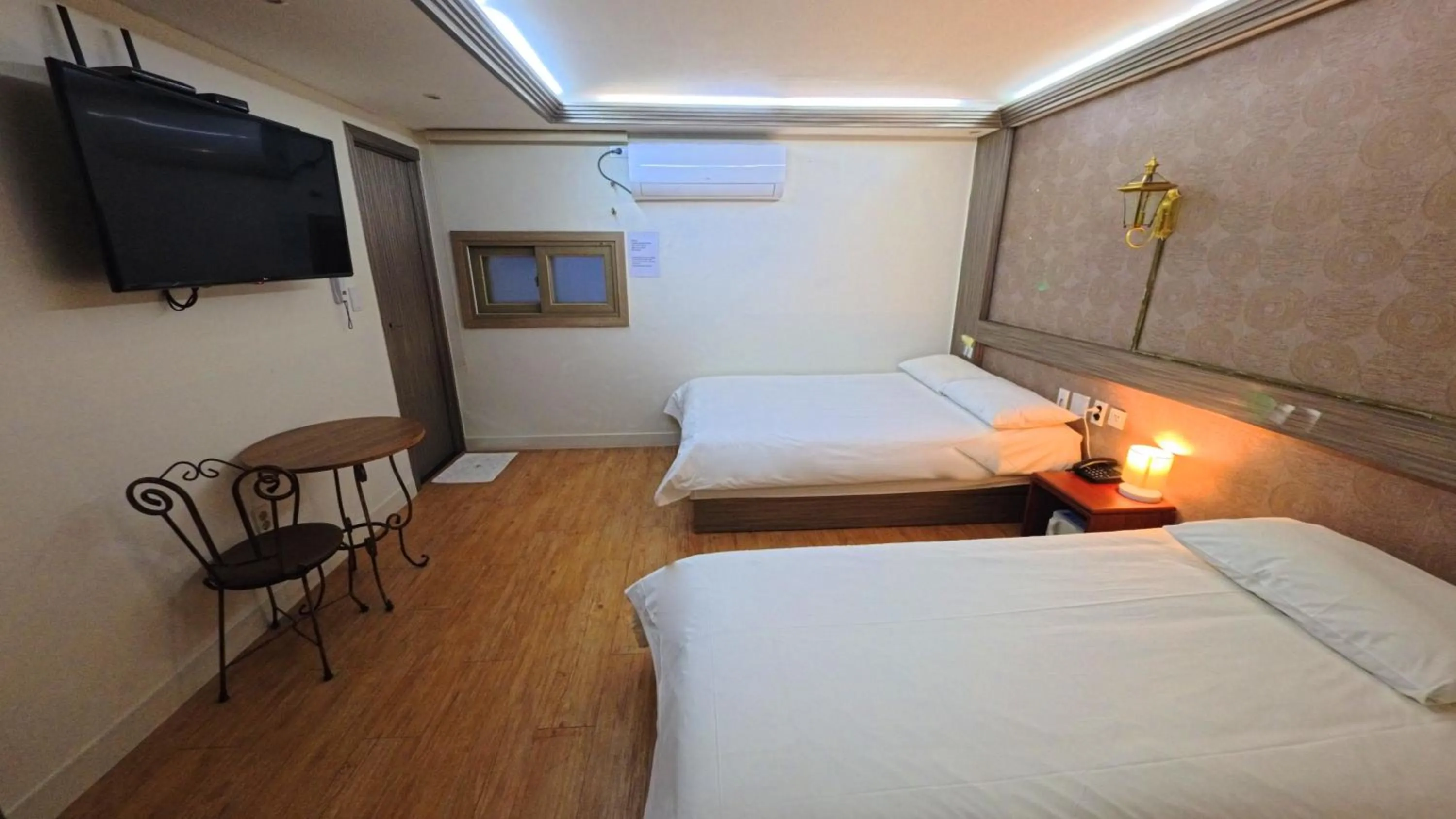 Bed in Friendly DH Naissance Hotel by Mindrum Group