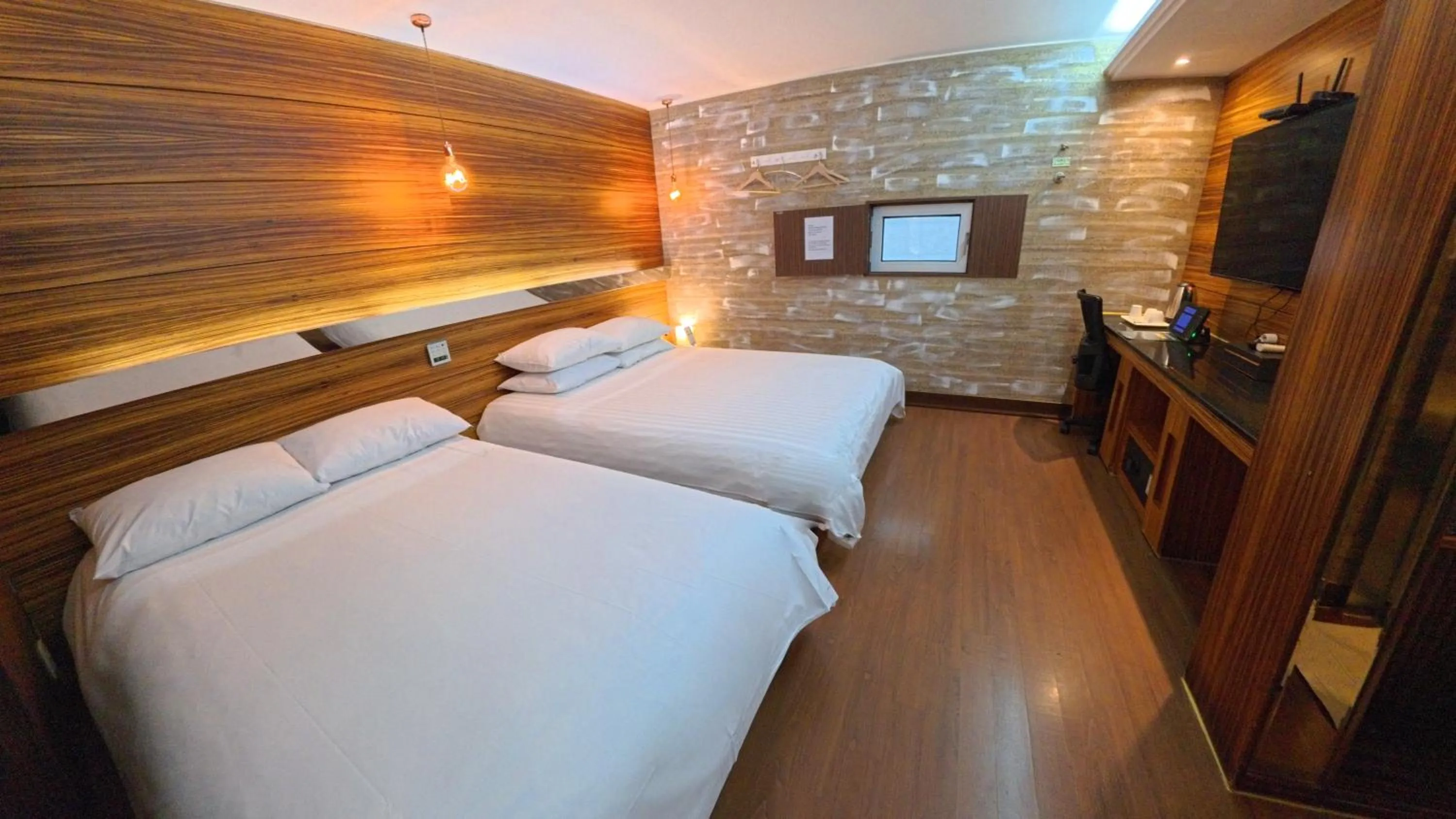 Bed in Friendly DH Naissance Hotel by Mindrum Group