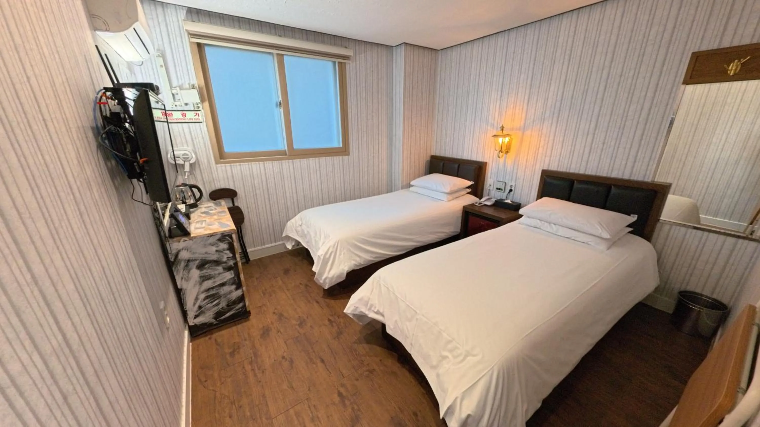 Bed in Friendly DH Naissance Hotel by Mindrum Group
