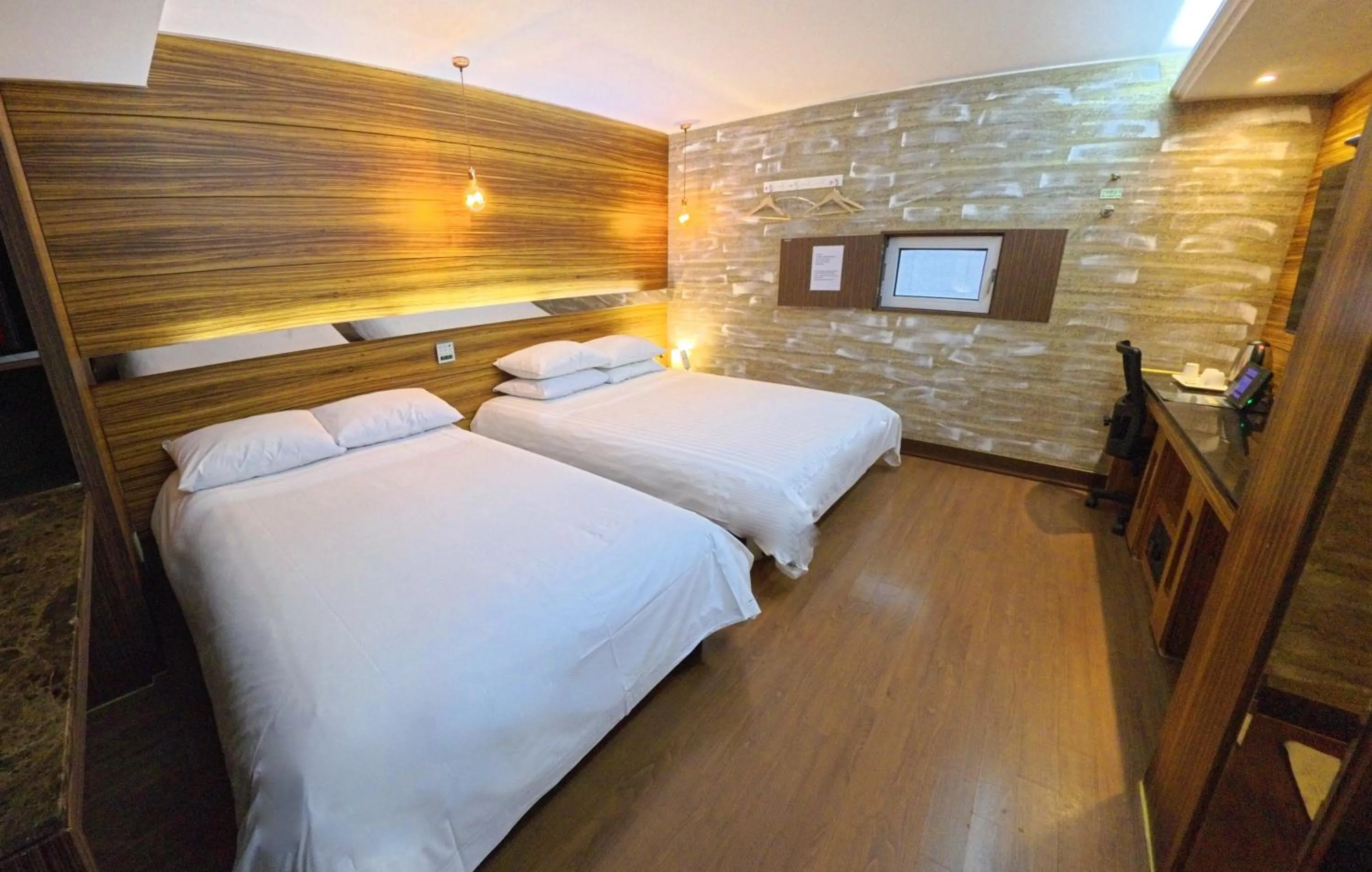 Bed in Friendly DH Naissance Hotel by Mindrum Group
