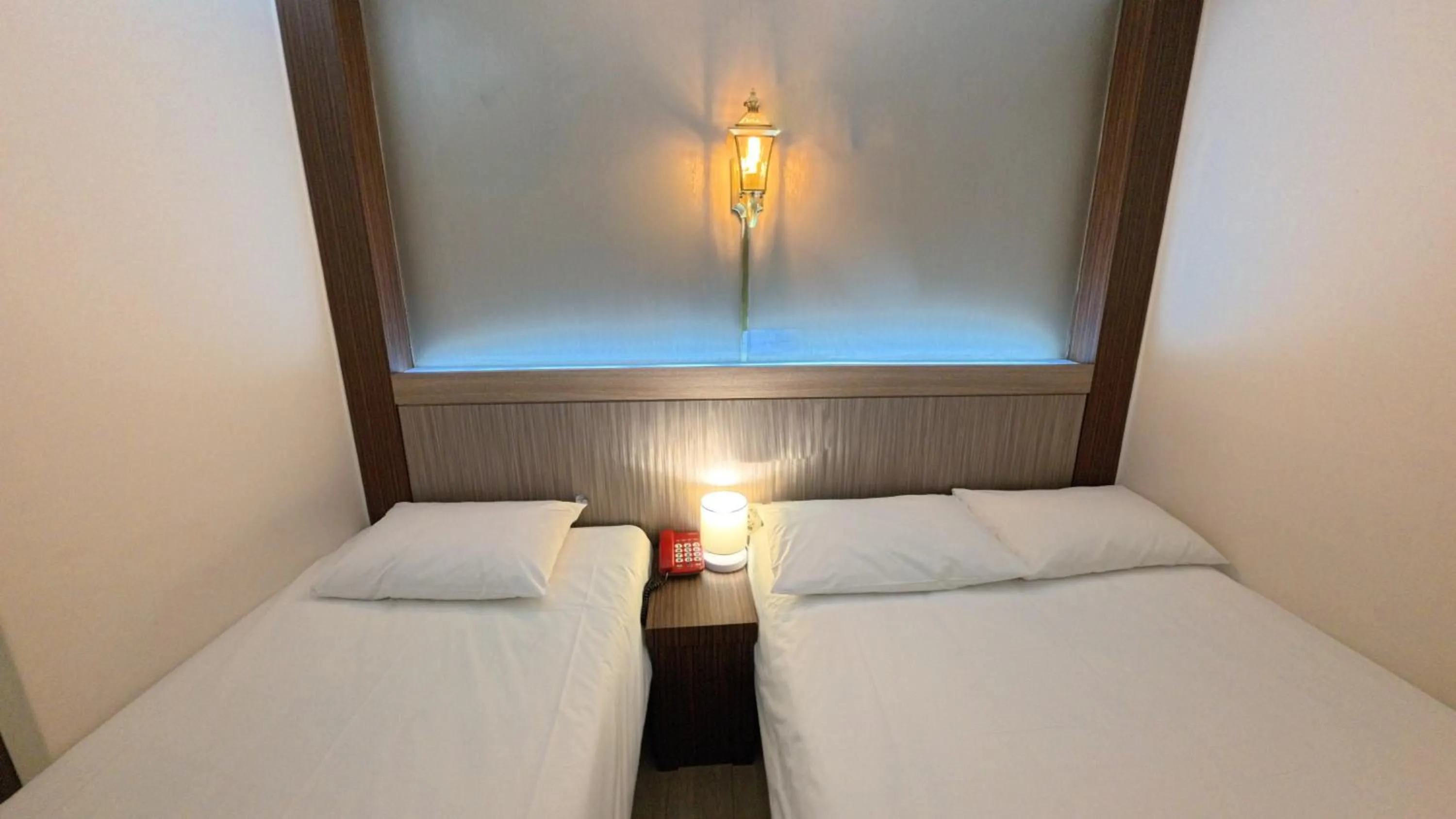 Bed in Friendly DH Naissance Hotel by Mindrum Group