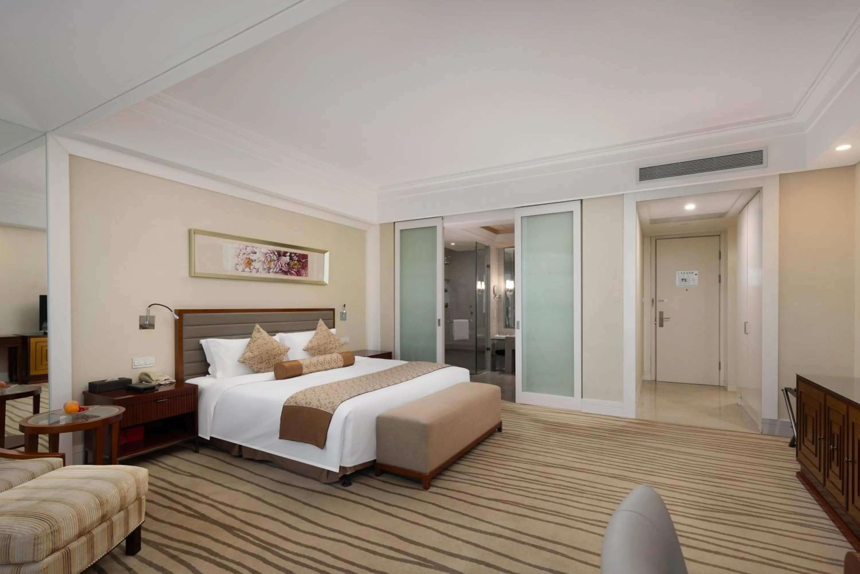 Bed in New Century Hotel Qingdao