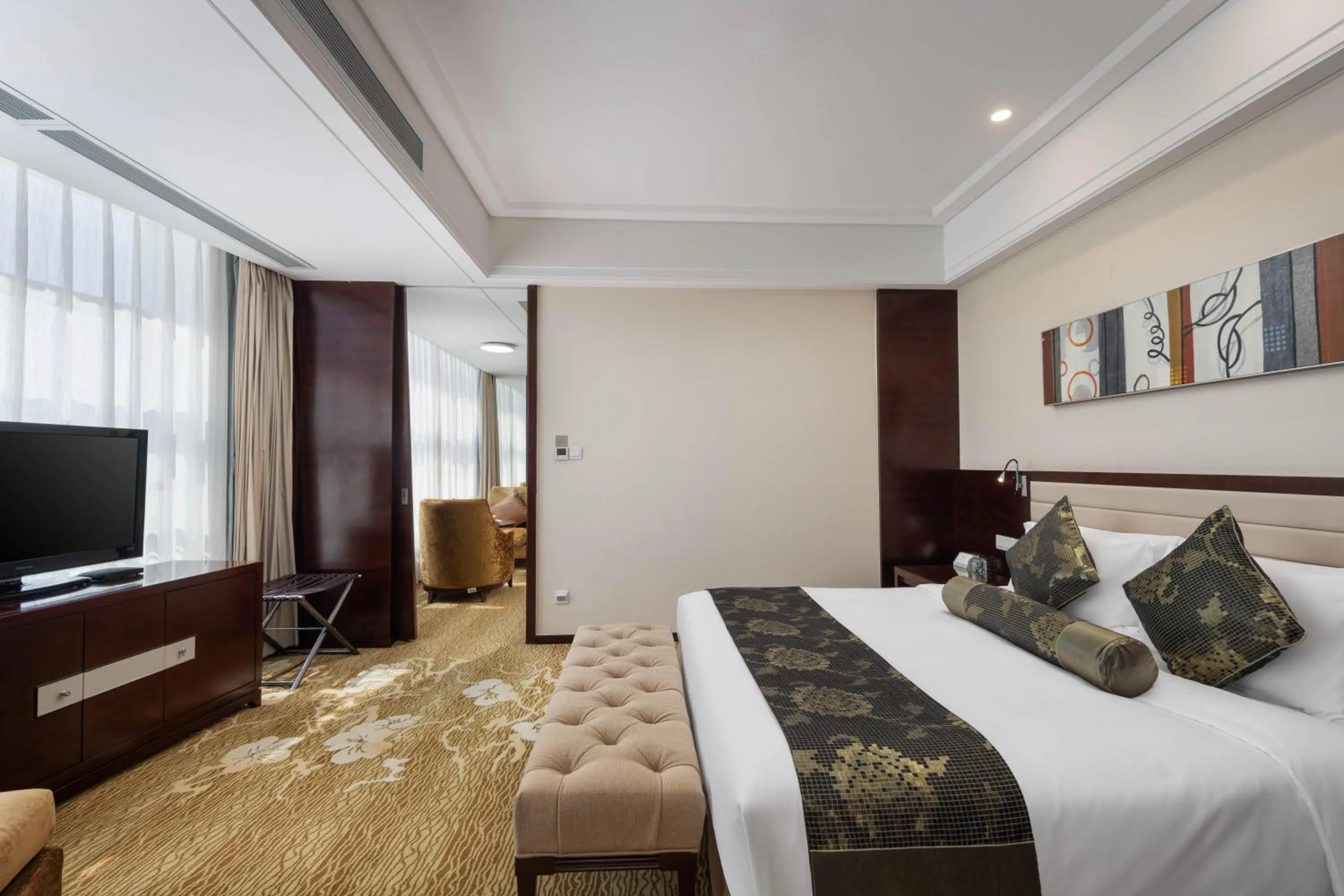 Bed in New Century Hotel Qingdao