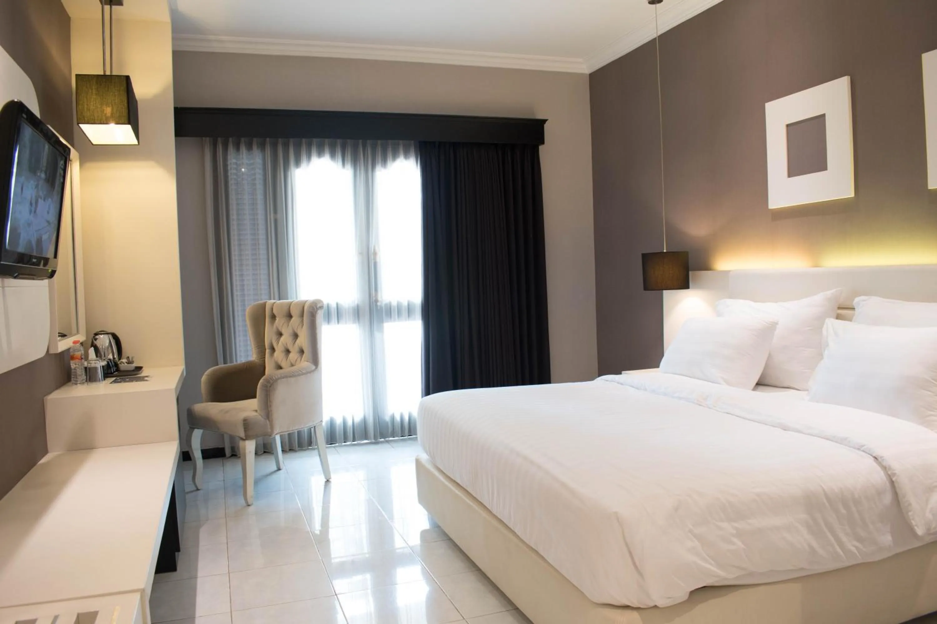 Bedroom, Bed in Luminor Hotel Jember By WH