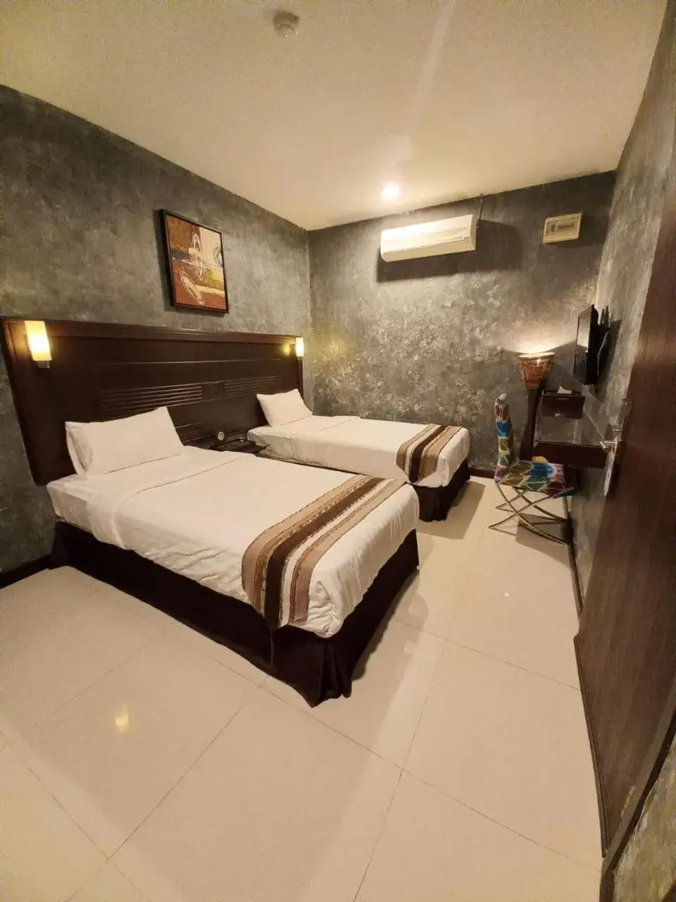 Bed in GM Hotel Bed in GM Hotel