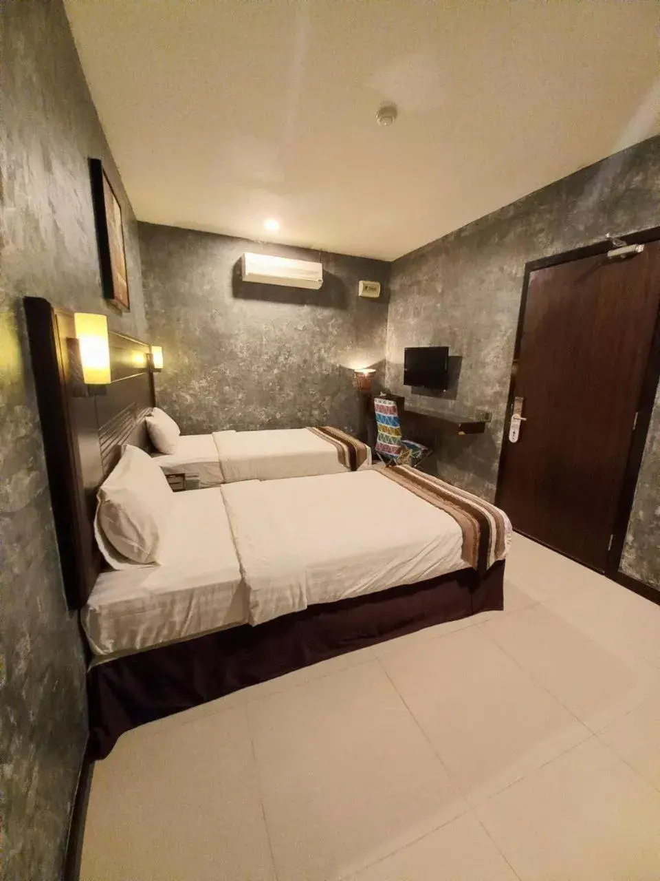 Bed in GM Hotel Bed in GM Hotel