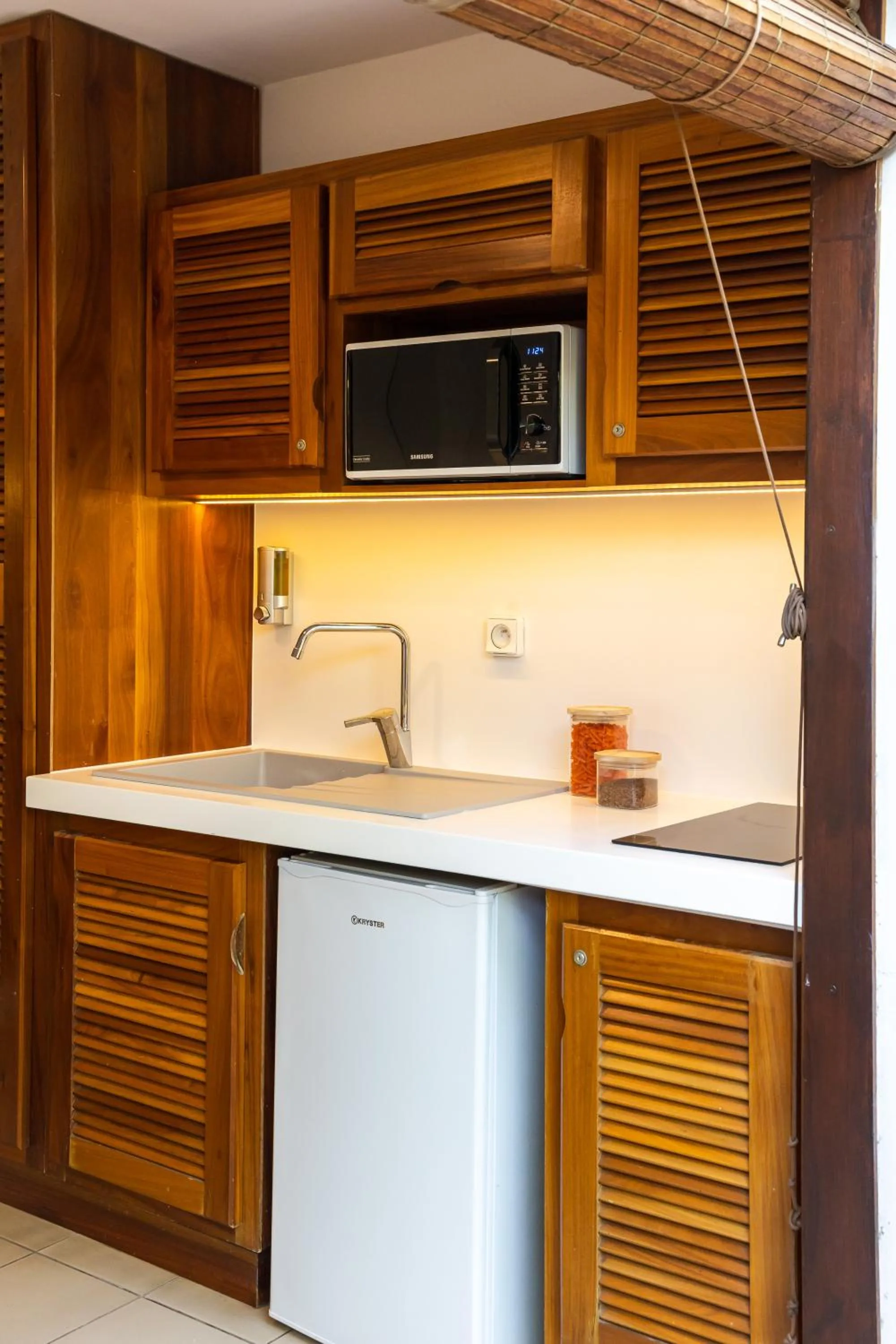 Kitchen or kitchenette in Résidence Tropic Appart Hotel