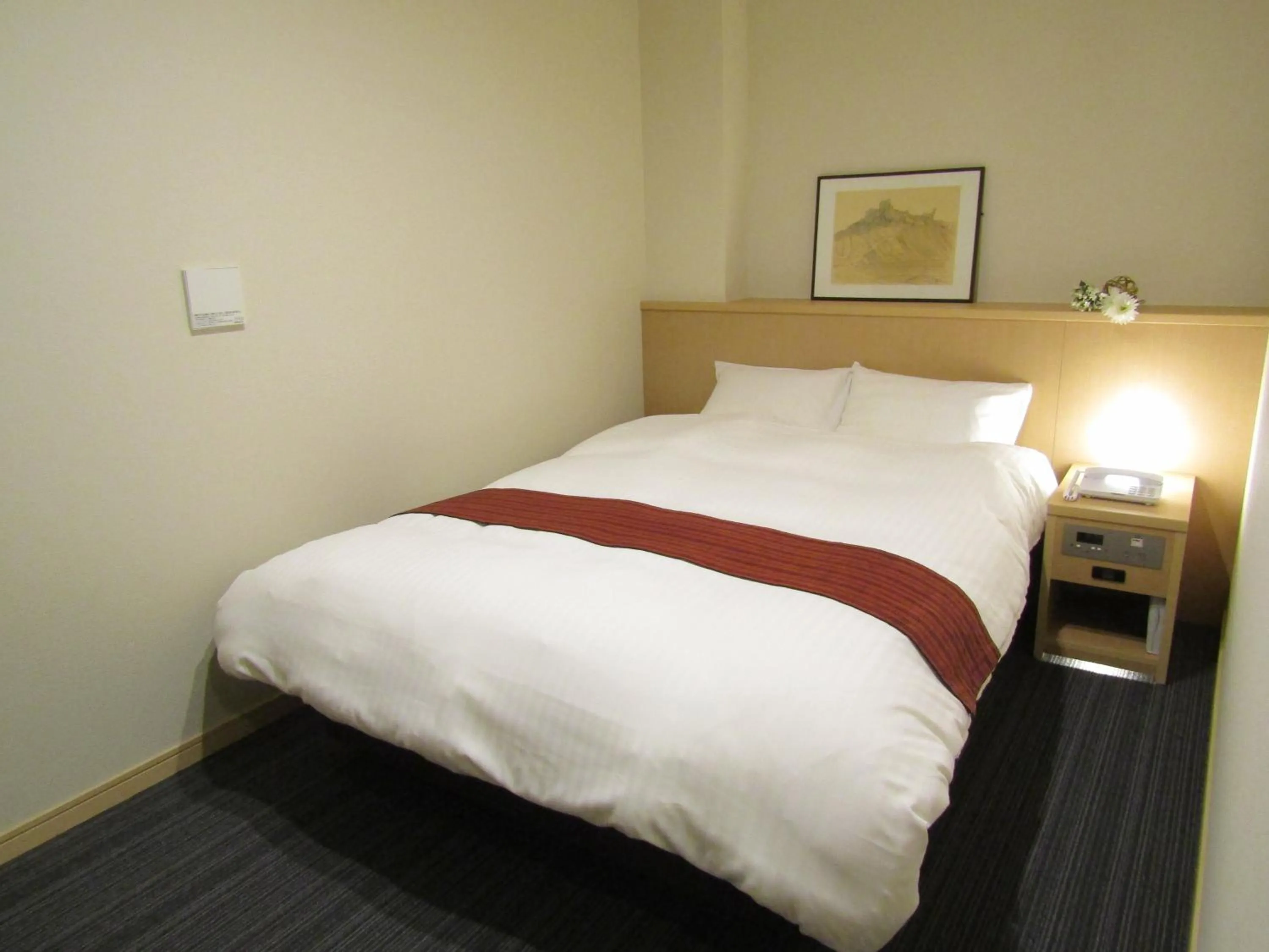 Bed in Japanese Style Hotel Isomura