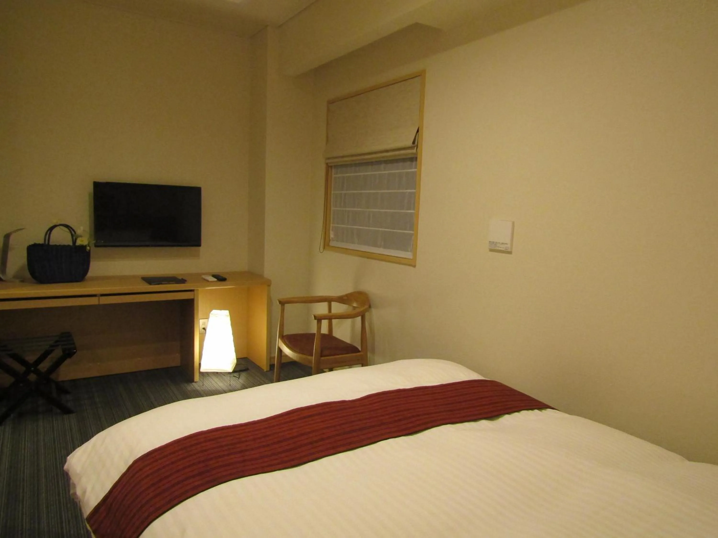 Bed in Japanese Style Hotel Isomura