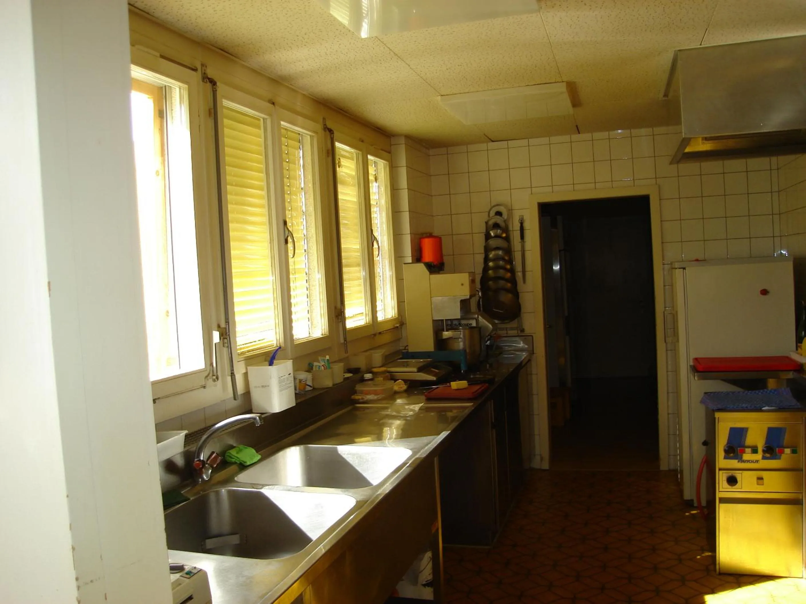 Kitchen or kitchenette in Hotel Milan B&B