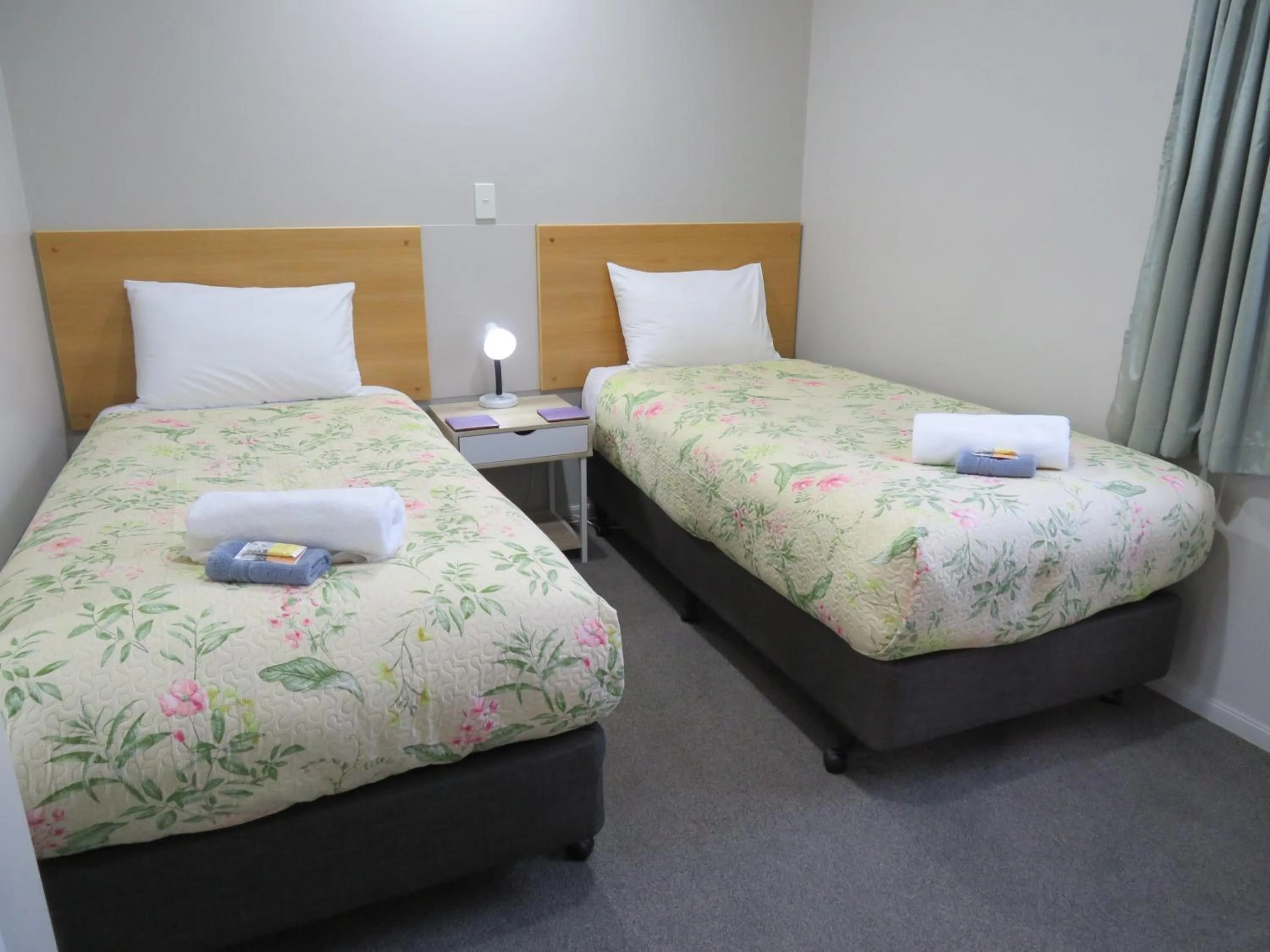 Bed in Commodore Court Motel