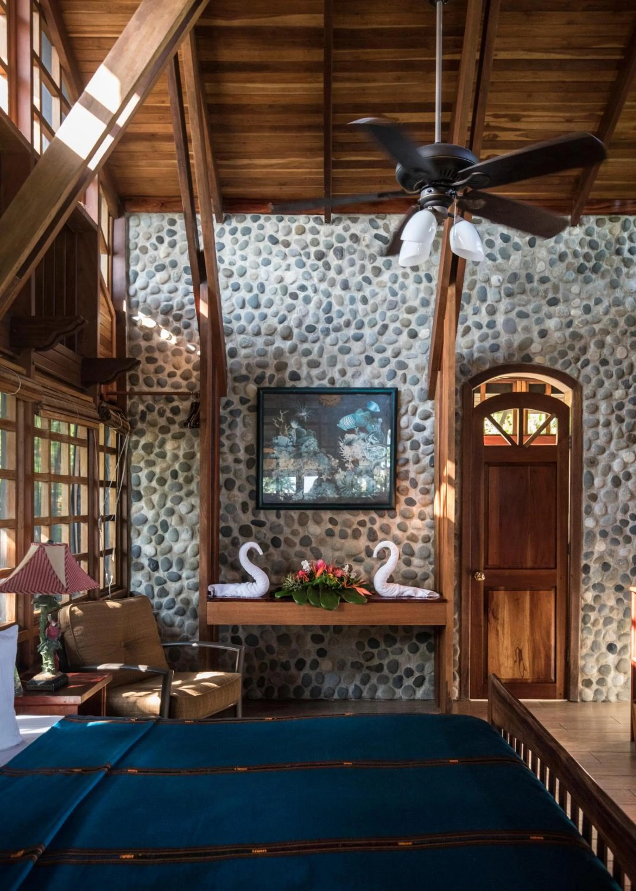 Bed in Aguila de Osa Rainforest Lodge