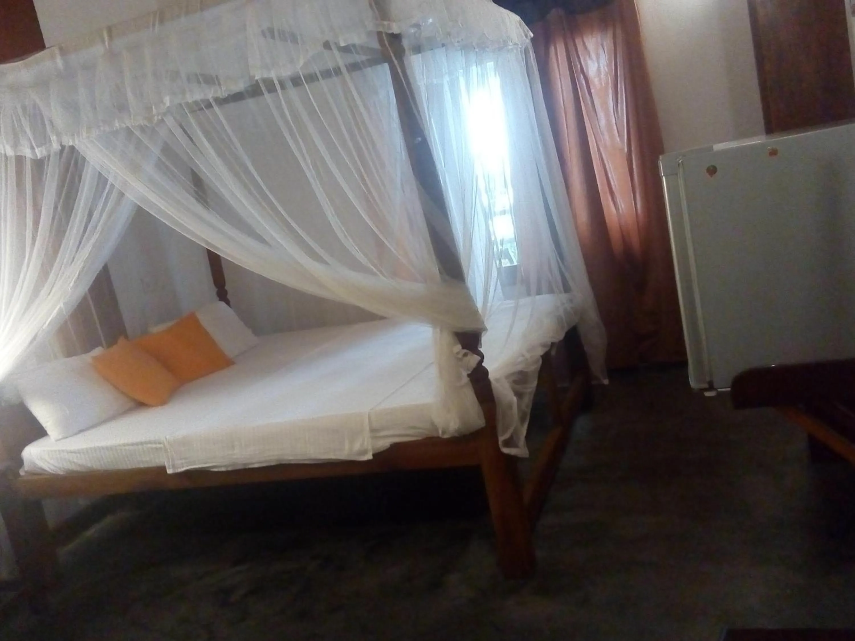Bed in Sunset Colony Beach Resort