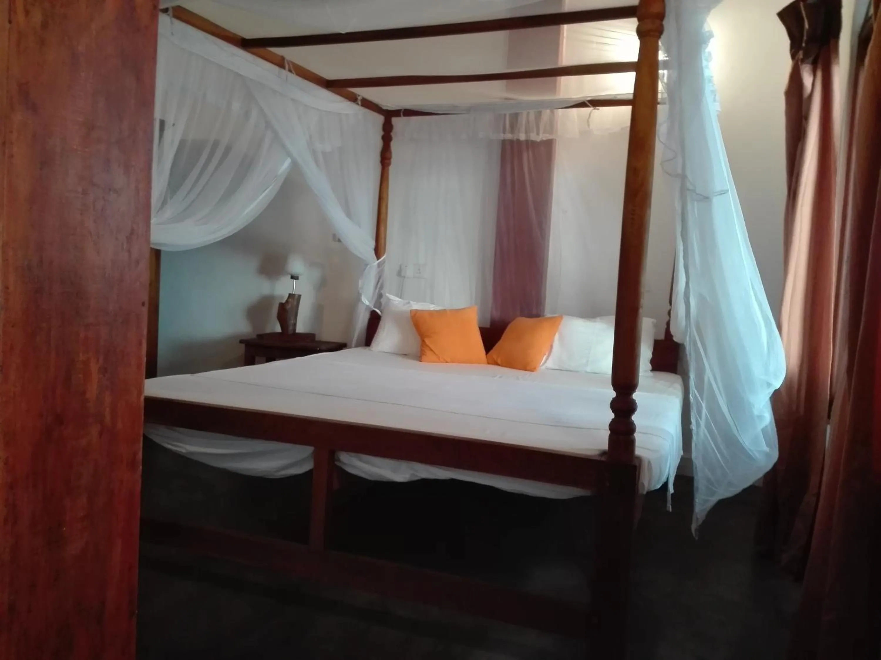 Bed in Sunset Colony Beach Resort