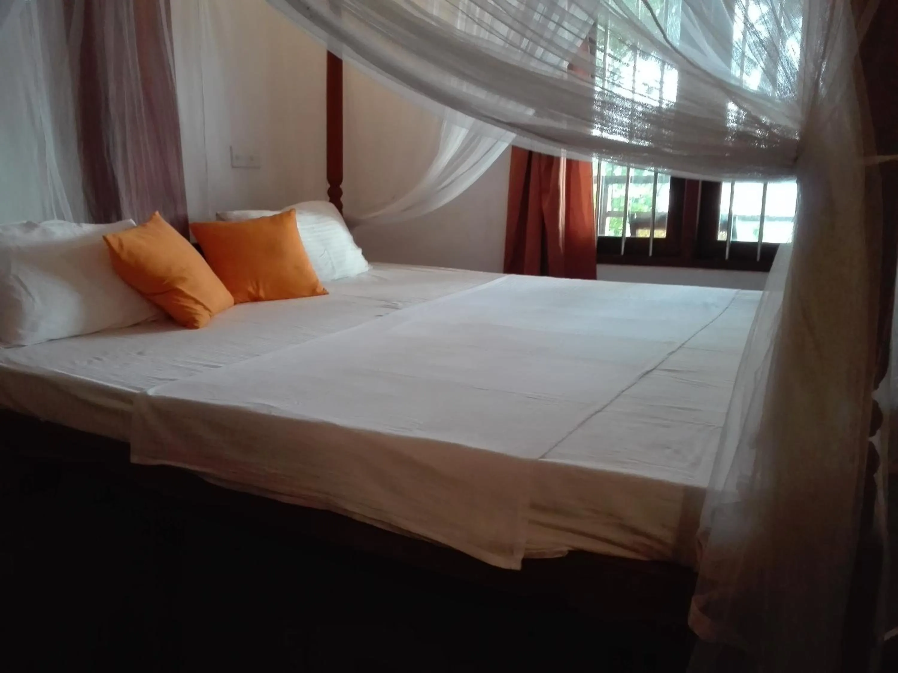 Bed in Sunset Colony Beach Resort