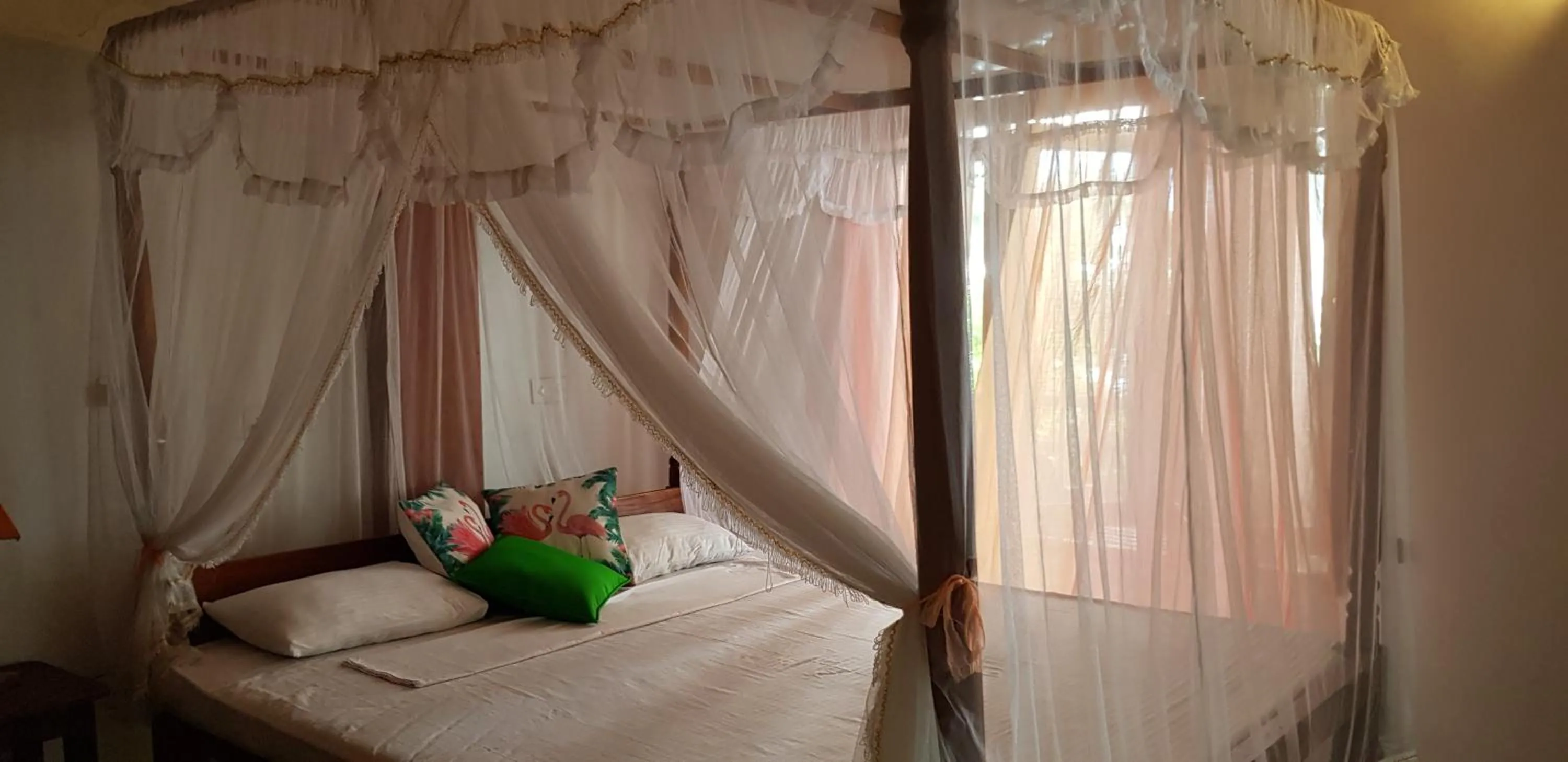 Bed in Sunset Colony Beach Resort