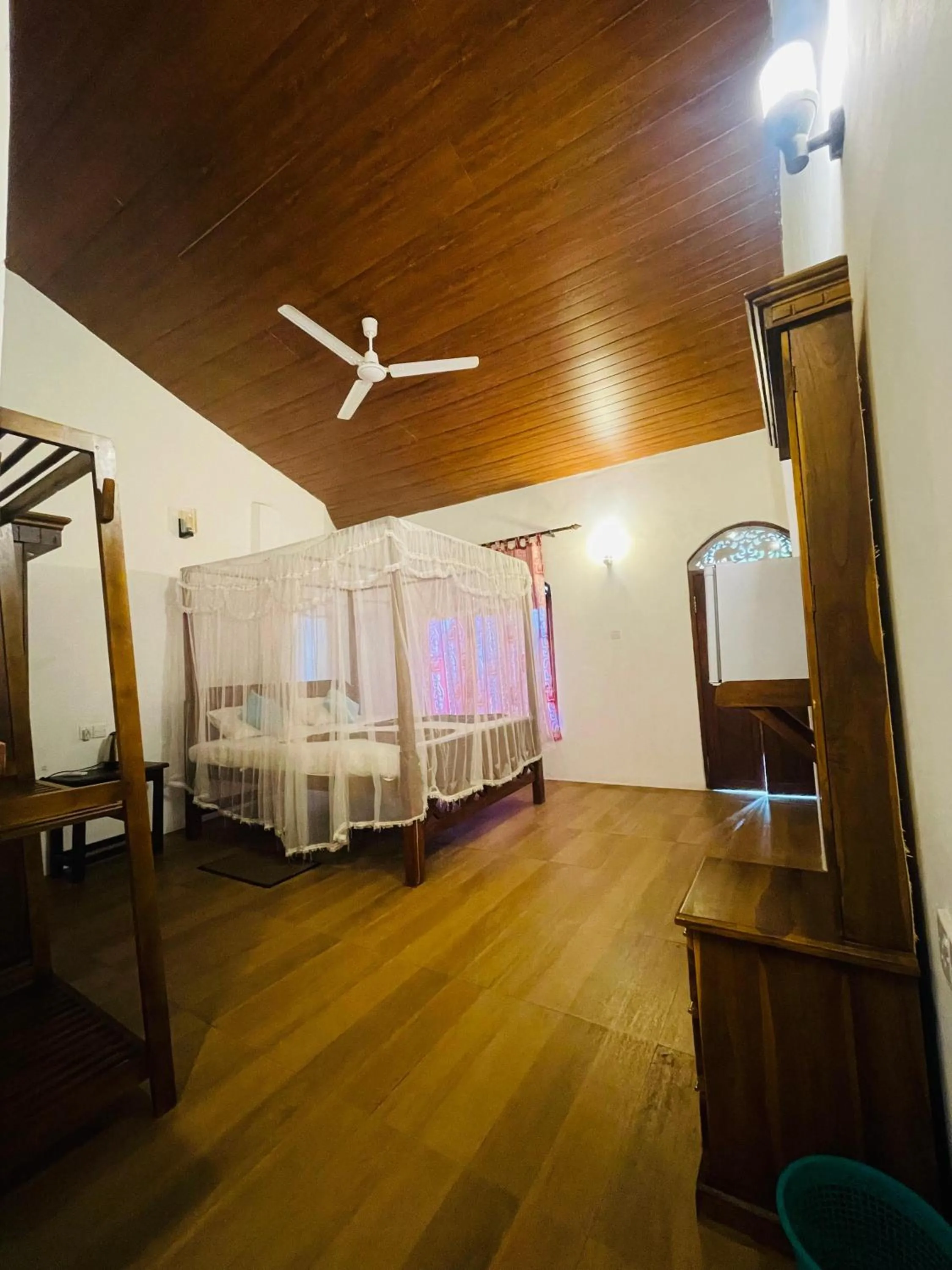 Bed in Sunset Colony Beach Resort