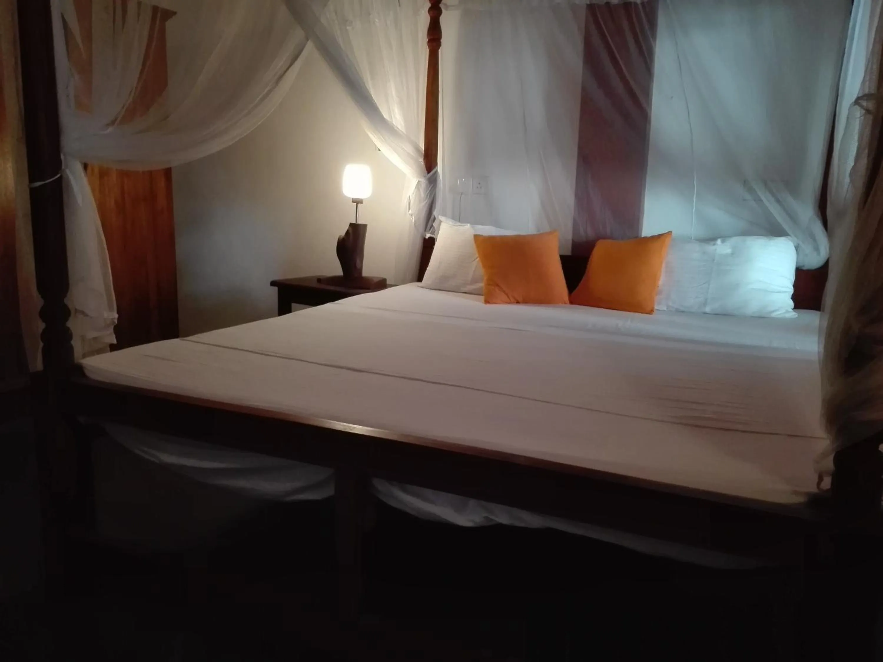 Bed in Sunset Colony Beach Resort
