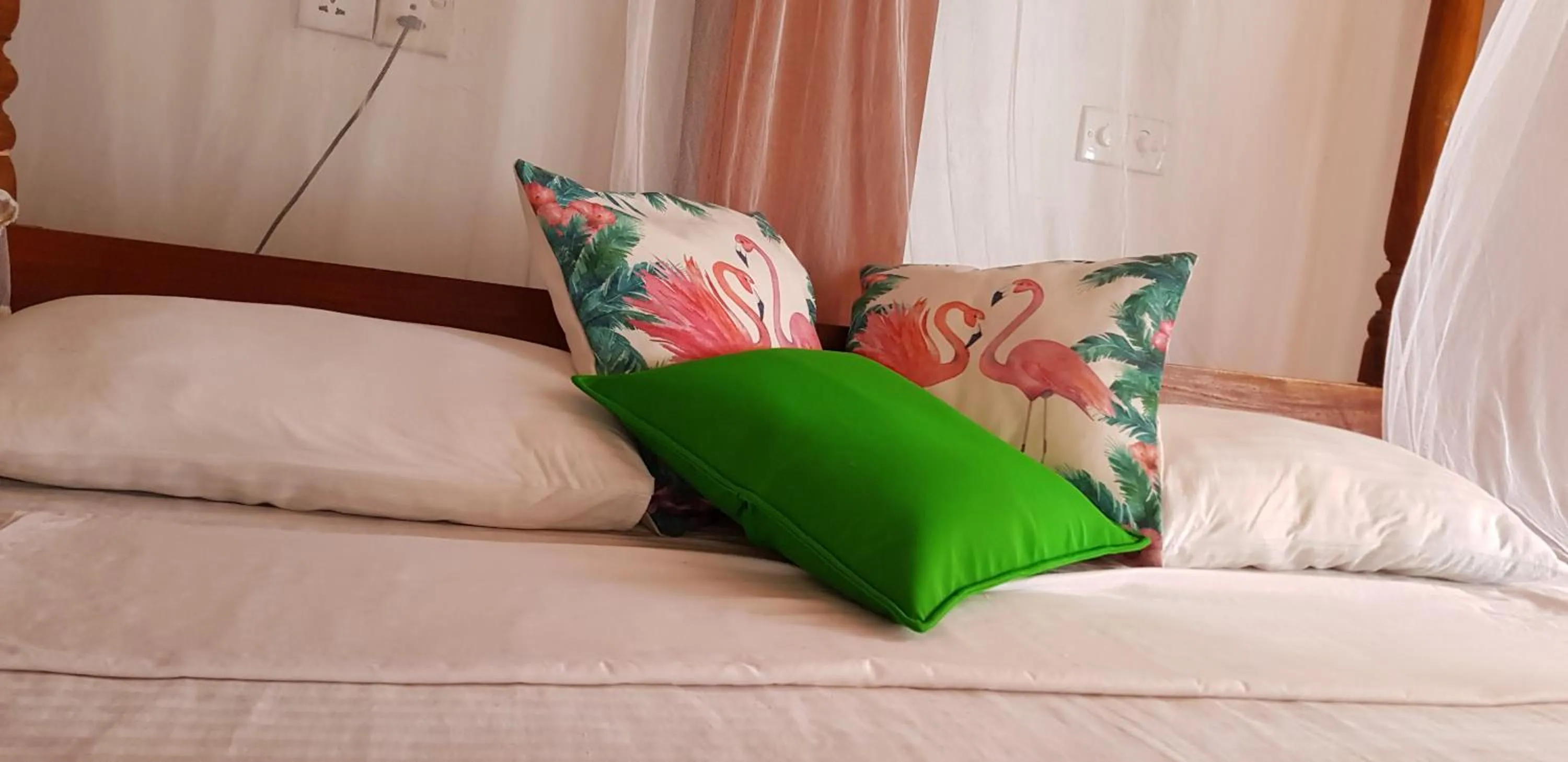Bed in Sunset Colony Beach Resort