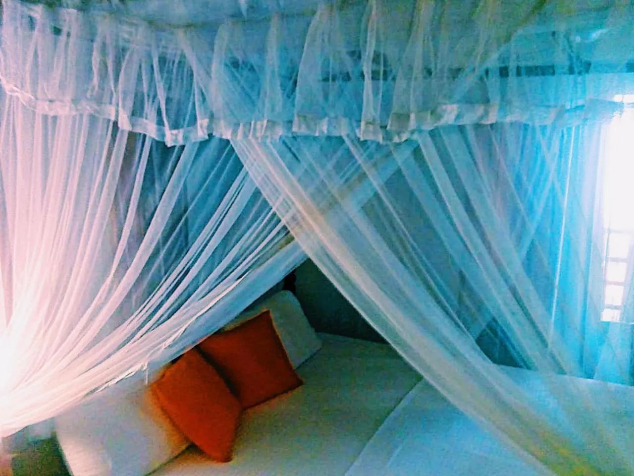 Bed in Sunset Colony Beach Resort