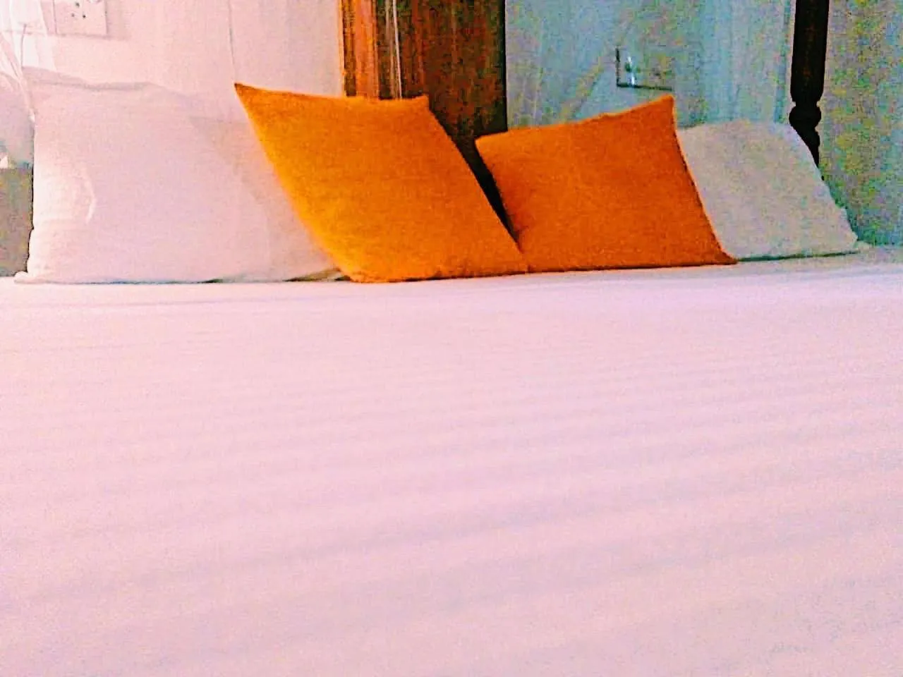 Bed in Sunset Colony Beach Resort